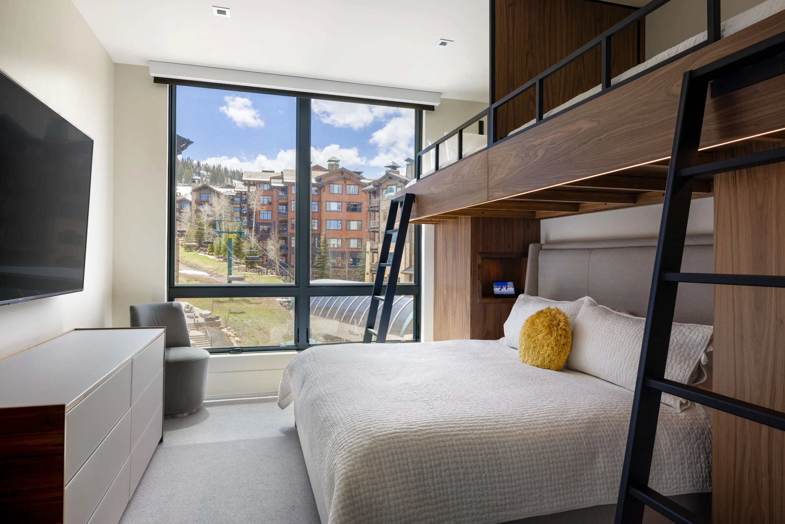 Bunk room sleeps 4 with a king bed below and two twins above.