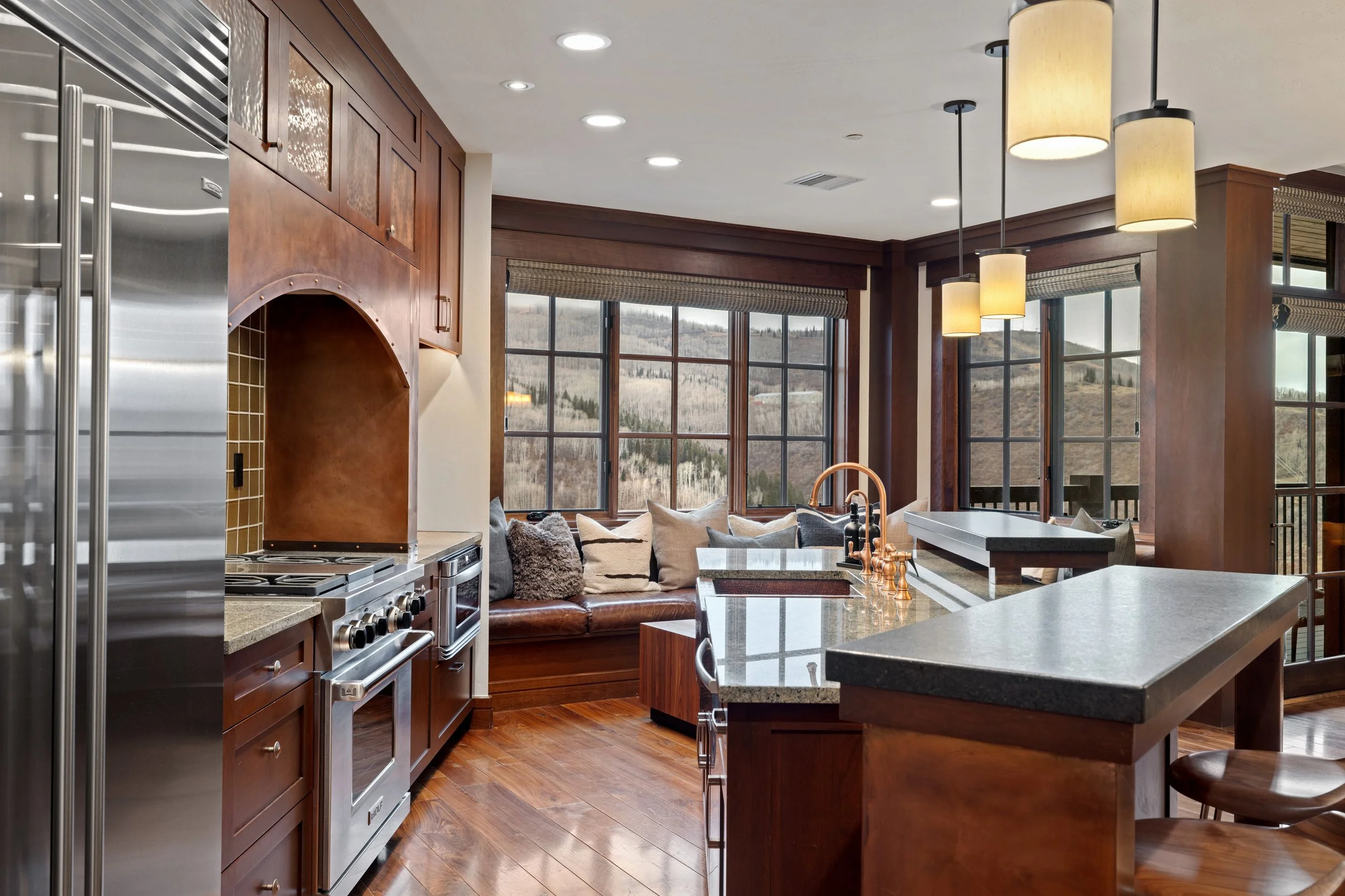 Chef's kitchen with granite countertops and mountain views from every angle