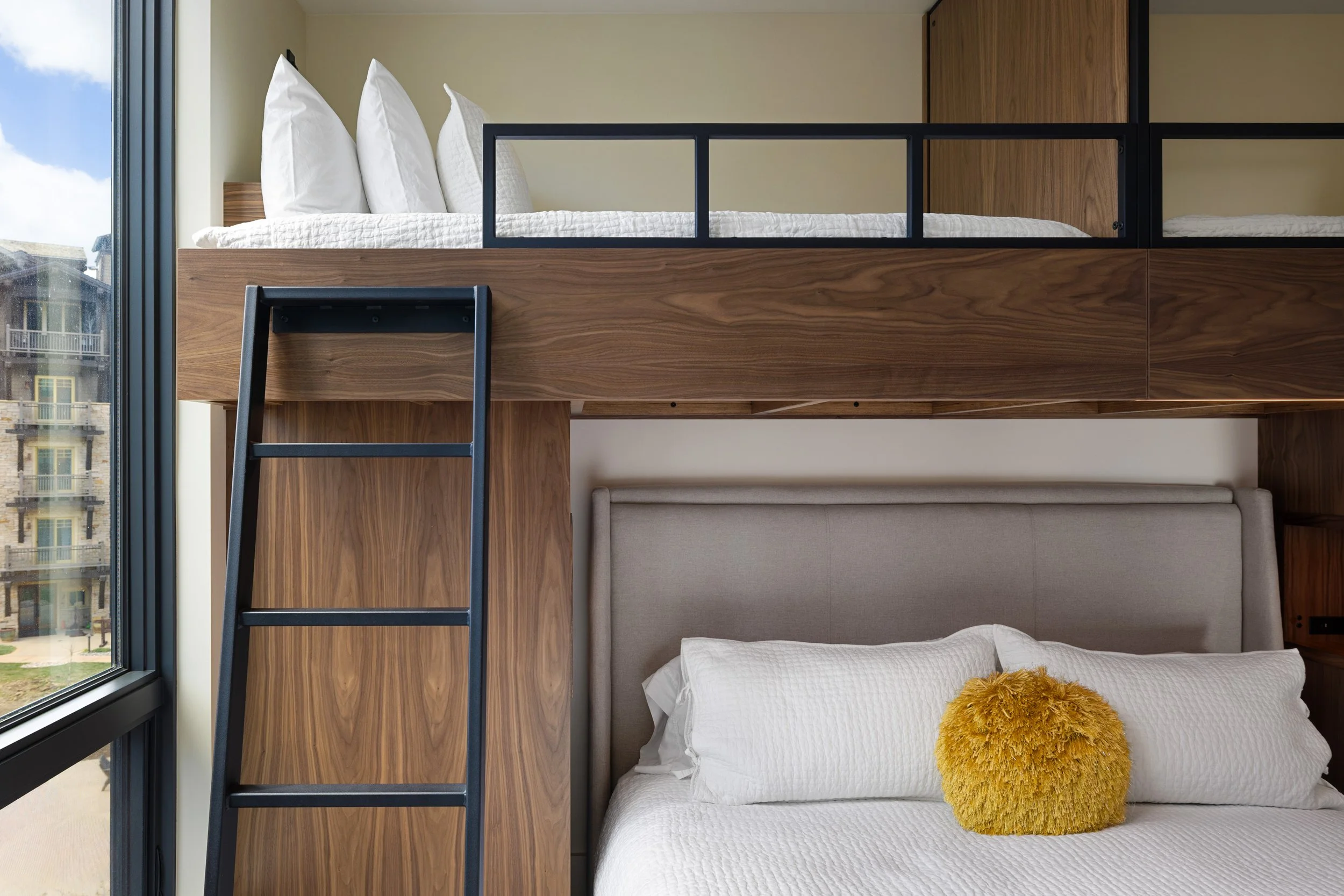 Bunk room sleeps 4 with a king bed below and two twins above.