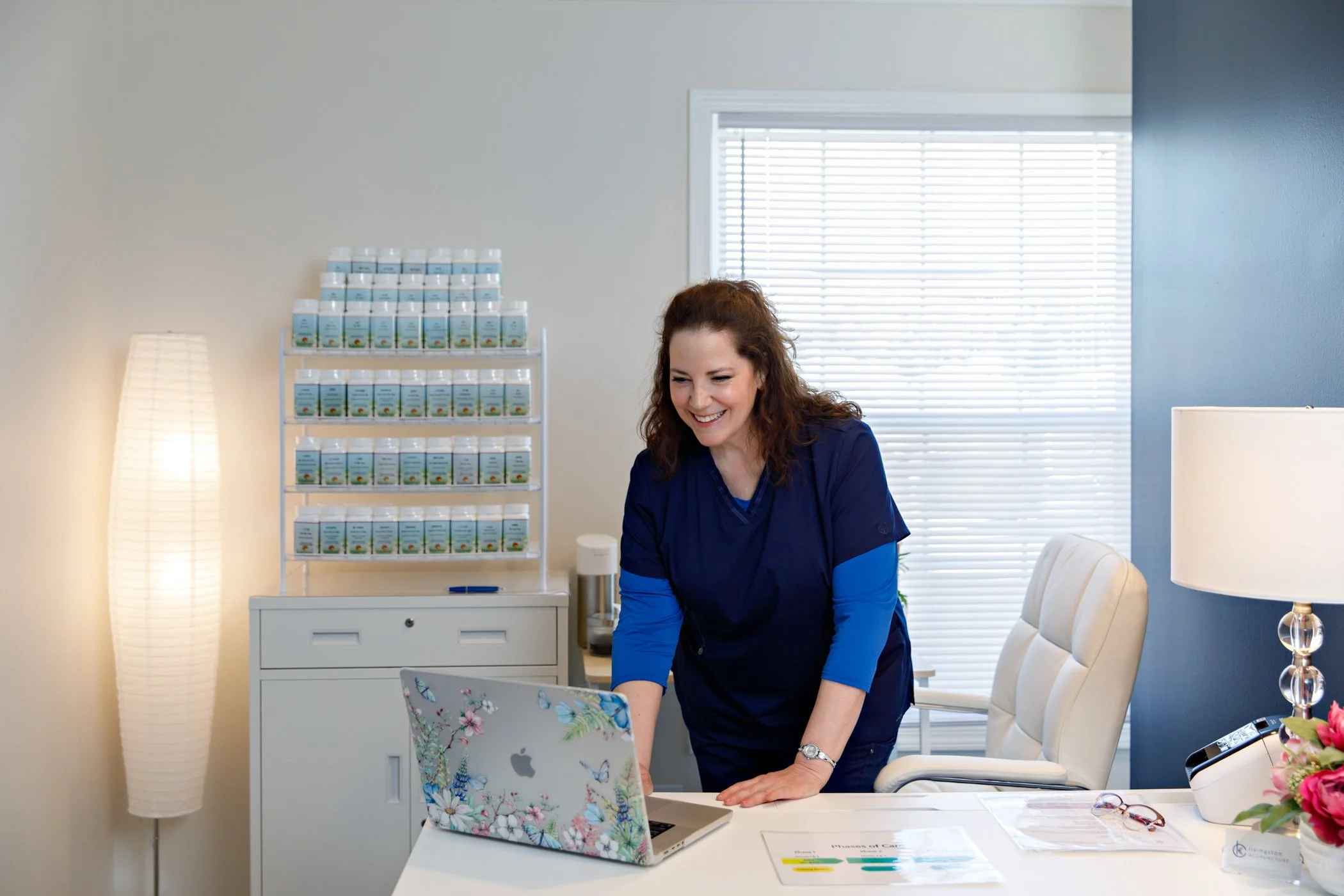 Office Carol Standing at Computer.jpg