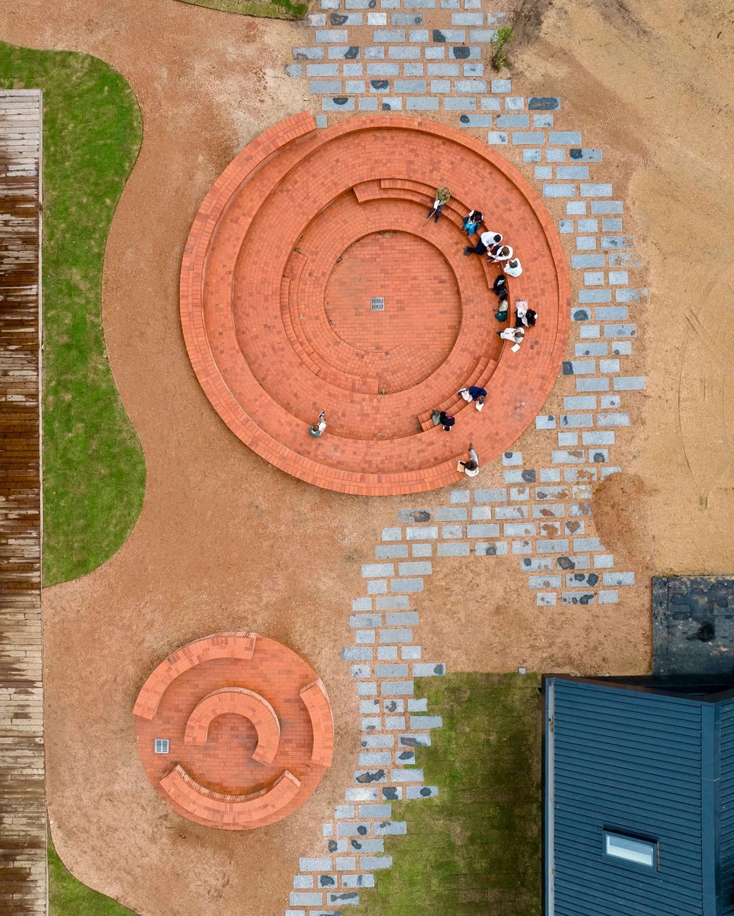 Not every classroom has walls.

At the heart of our Learning Village &mdash; where learners of every age cross paths, gather, and mix &mdash; two brick amphitheatres. One for the crowd. One for the conversation.

The brick is a nod to San Carlos, the