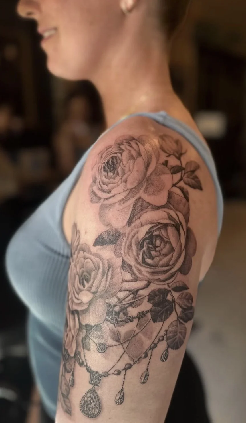 Feminine floral tattoo in black and gray style at Chariot Tattoo Studio in Boise, Idaho 