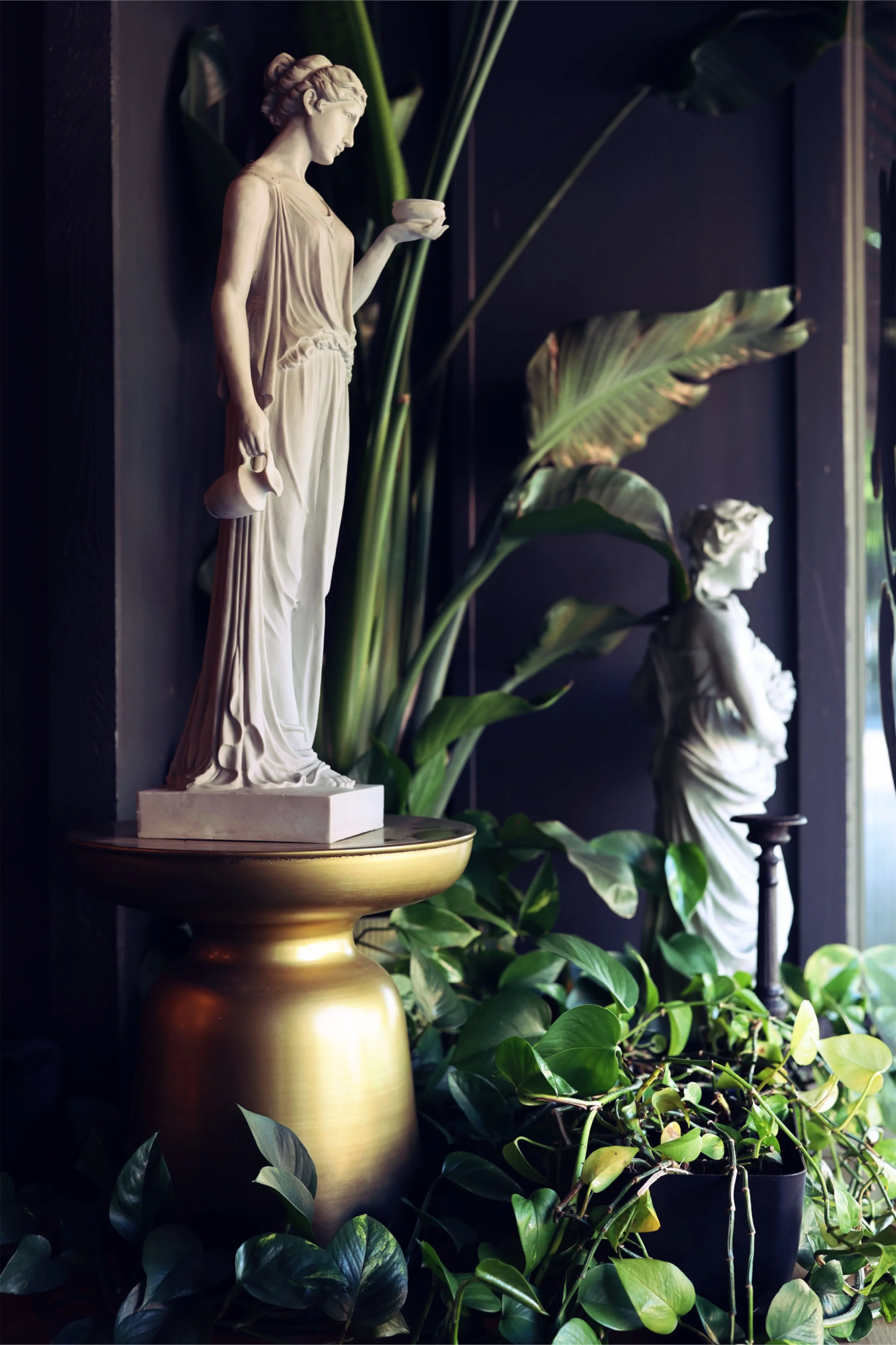 Stone greek statues are situated around the studio to show a consistent artistic theme and appreciation for fine art in Chariot's Boise tattoo + tattoo removal studio. 