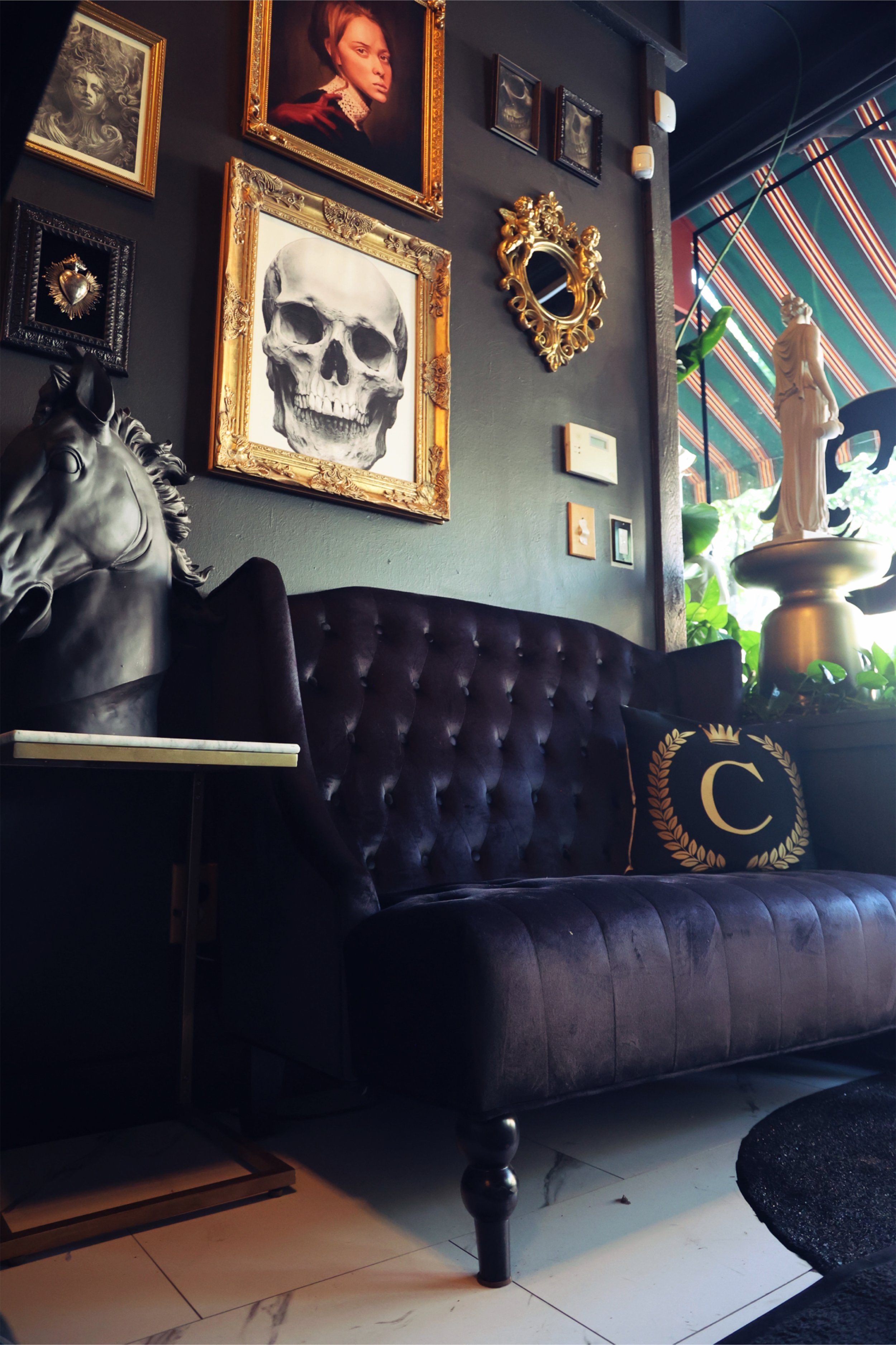 Renaissance-style art lines the walls floor to ceiling in Chariot's Boise studio in large gold ornate frames, setting the stage for artistic excellence as soon as you walk in the door. 