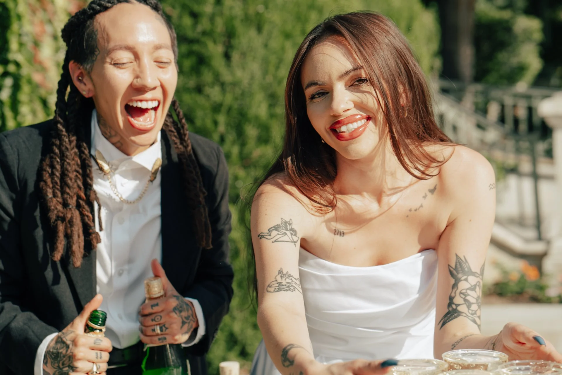two brides celebrate their marriage with a champagne pour - Poise and Ivy Imagery