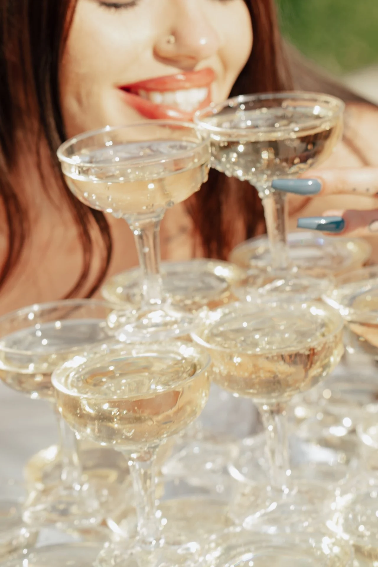 two brides celebrate their marriage with a champagne pour - Poise and Ivy Imagery