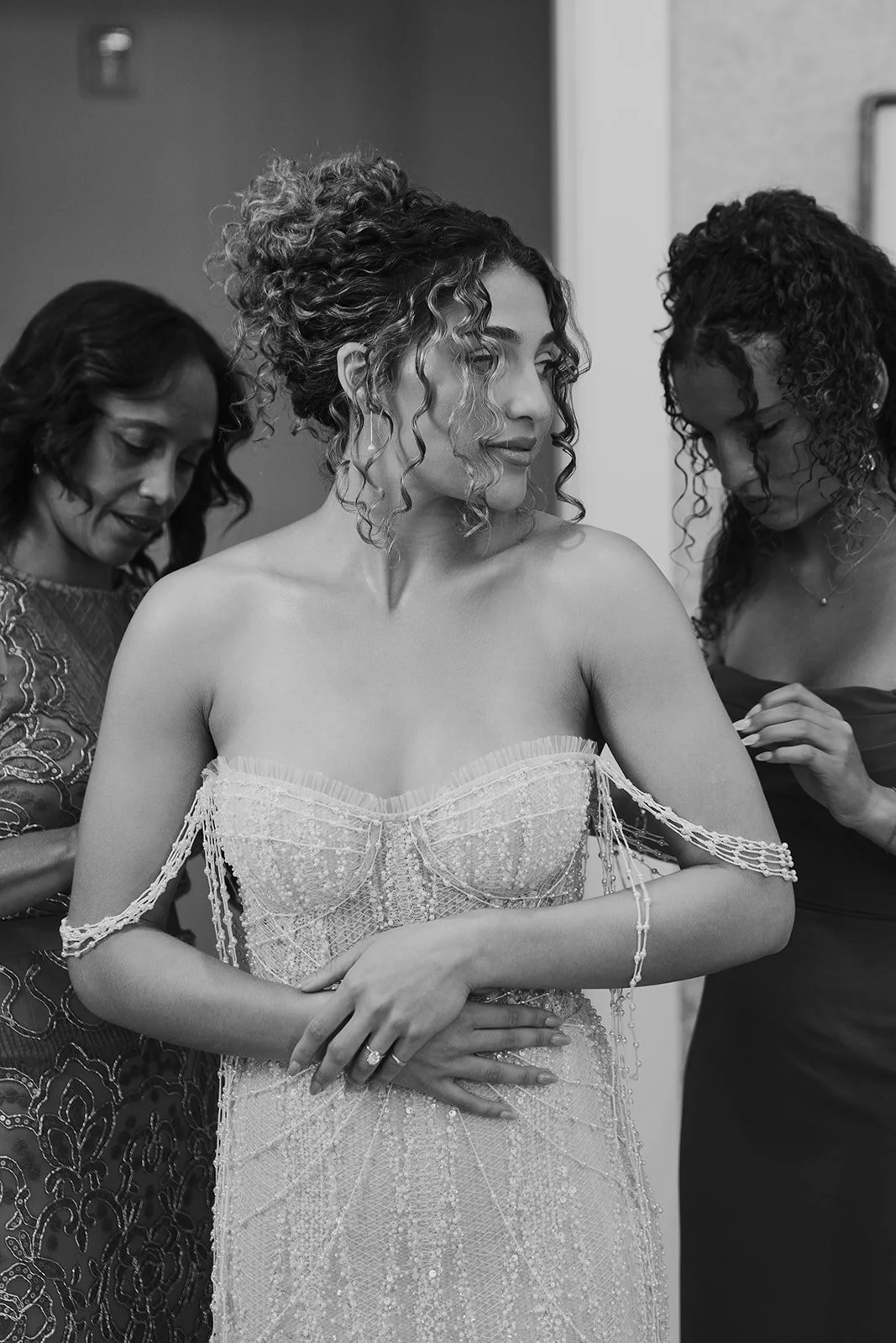 A bride and her mother getting ready for the wedding ceremony - photography by Poise and Ivy Imagery