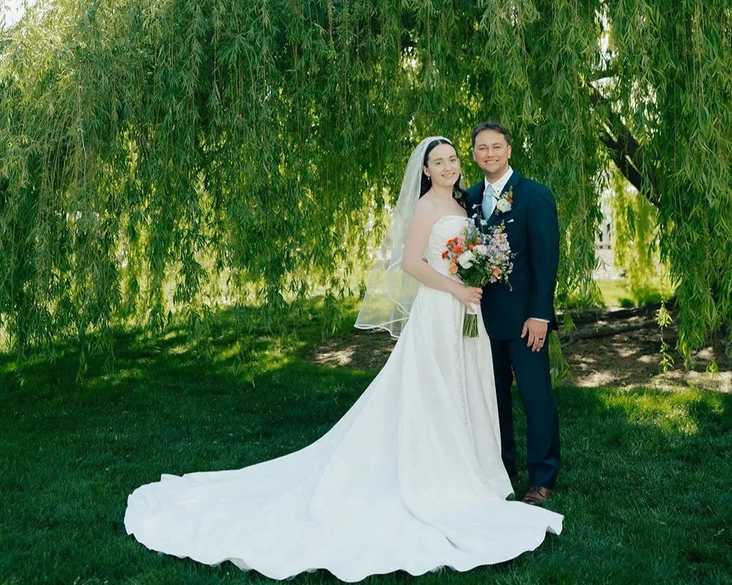 Utah bride and groom under a willow tree during their wedding at The Caledonia Wedding Venue in Utah, wedding photography by Poise and Ivy Imagery