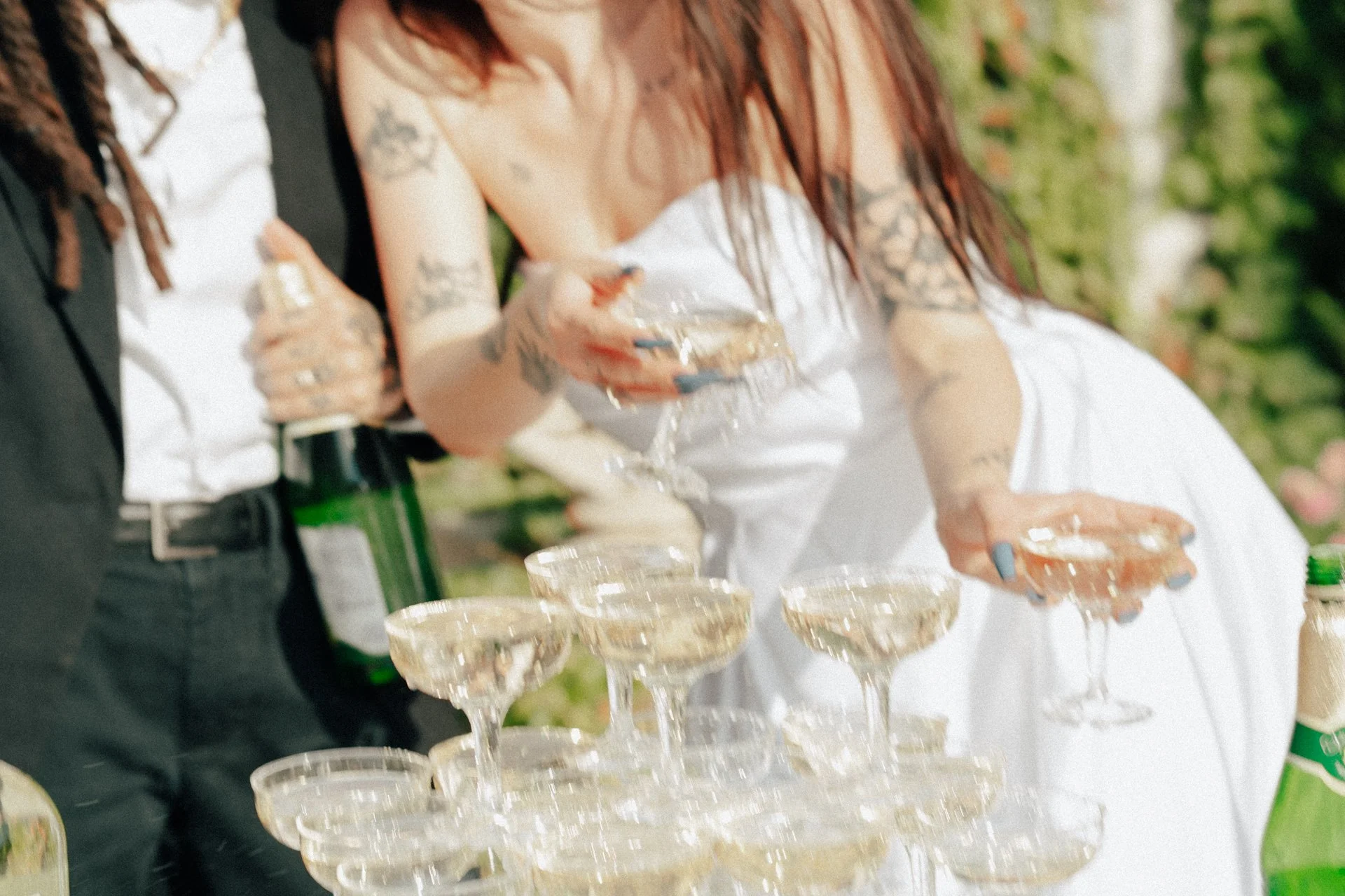 two brides celebrate their marriage with a champagne pour - Poise and Ivy Imagery