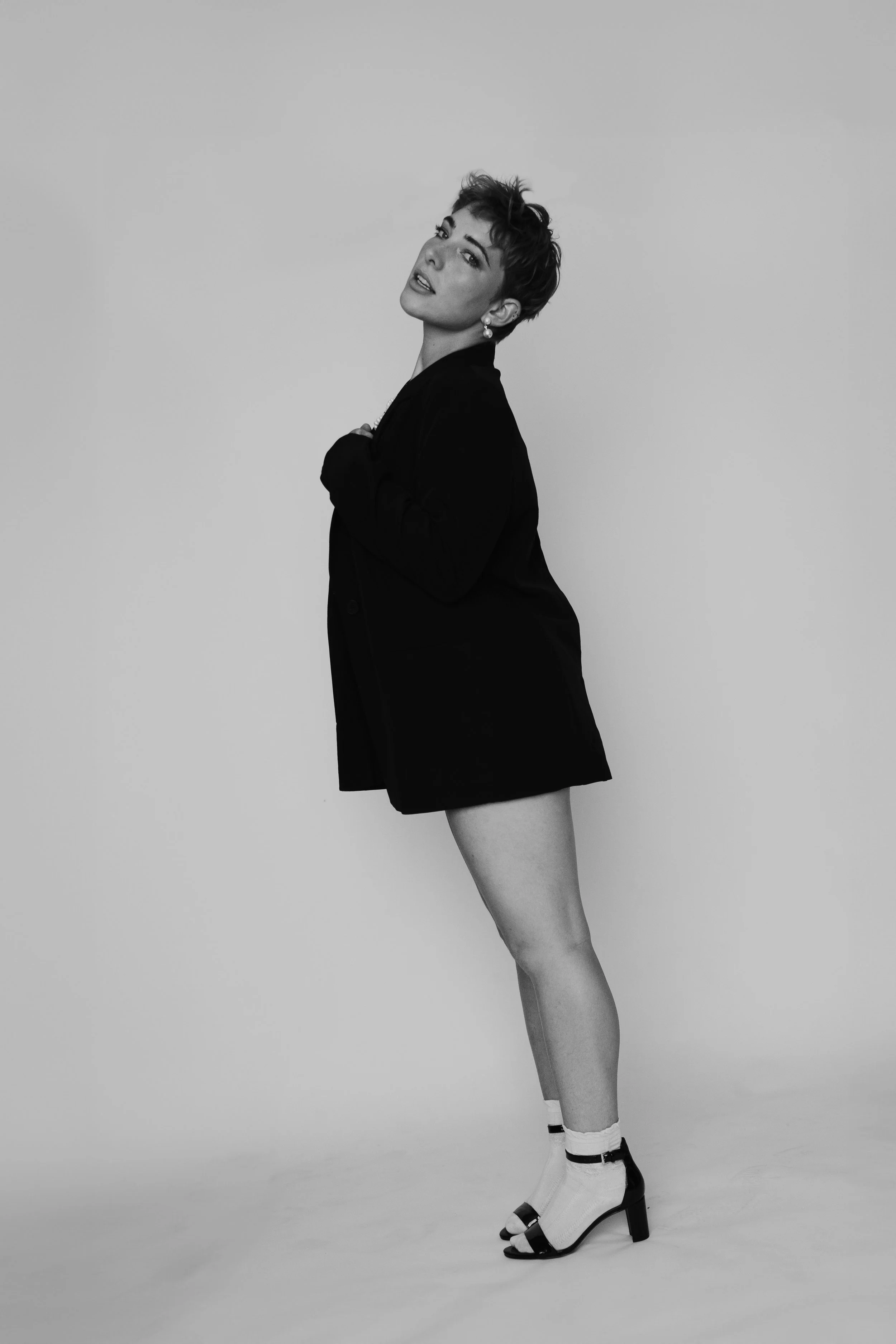 black and white portrait of a woman with a short haircut by Poise and Ivy Imagery