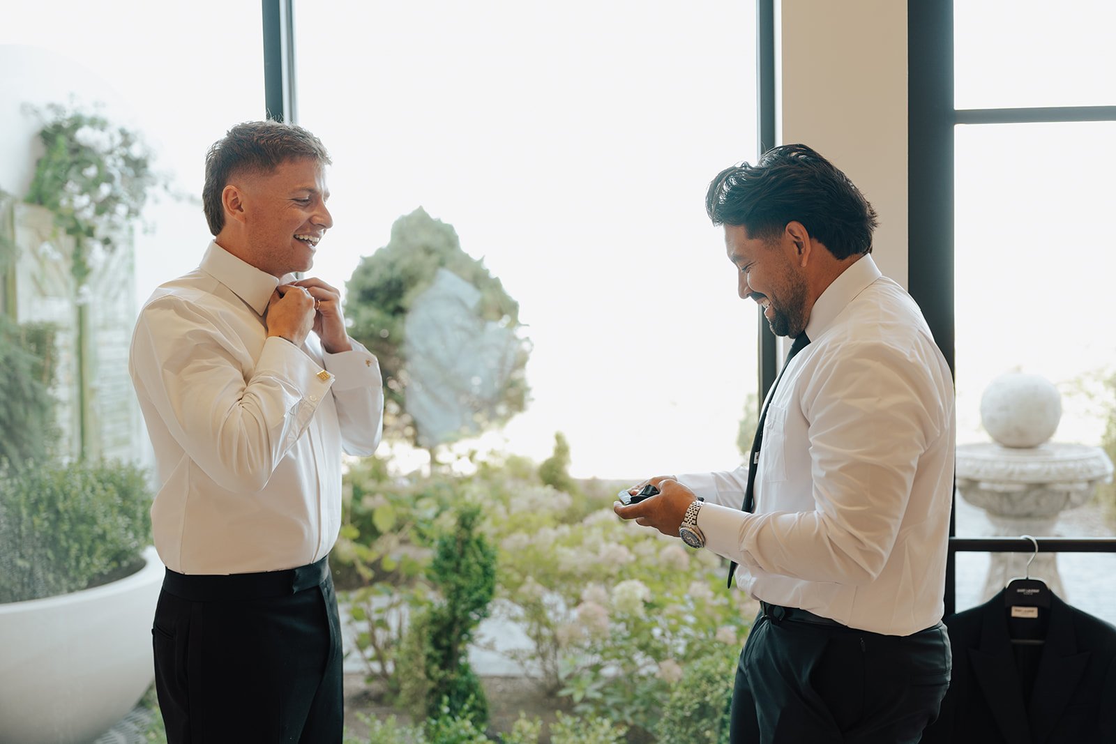 Groom and best man getting ready for the wedding ceremony together - photography by Poise and Ivy Imagery