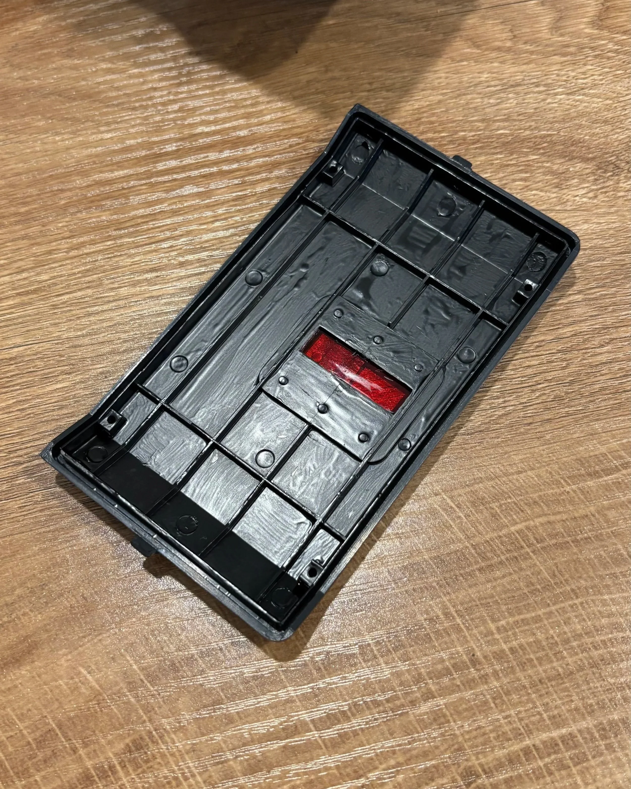 holga backing panel painted with matte black paint to prevent light reflections inside the camera