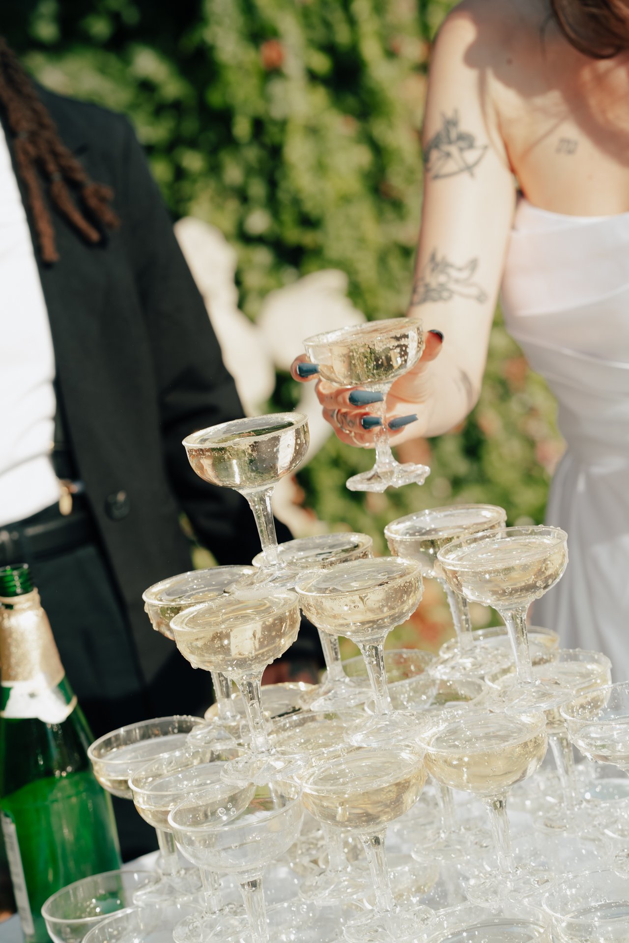 two brides celebrate their marriage with a champagne pour - Poise and Ivy Imagery