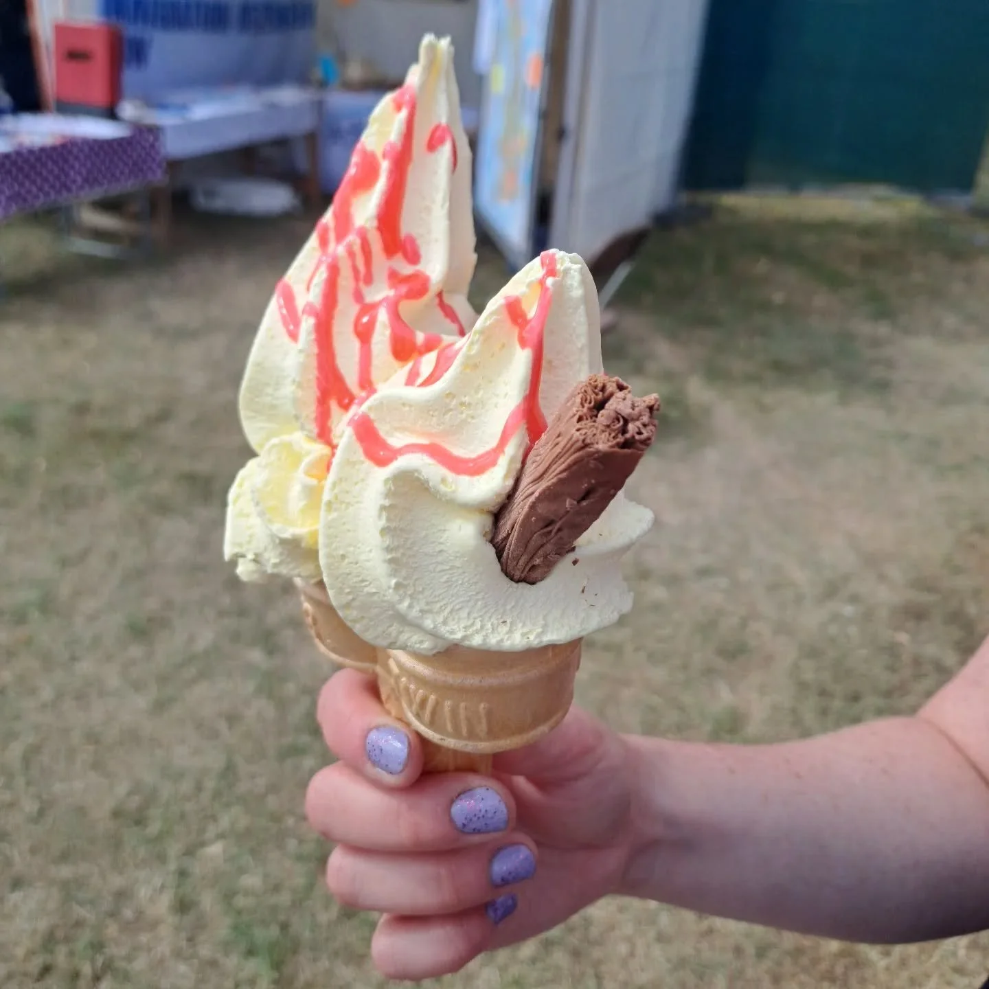 Find yourself someone who encourages you to go barefoot. And eat ice cream.

#Greenbelt #pilgrimage #barefeetarethebest #pilgrimsandicecream 

[Image descriptions: 1) a hand with purple glittery nails holding massive double 99. 2) a smiling couple su