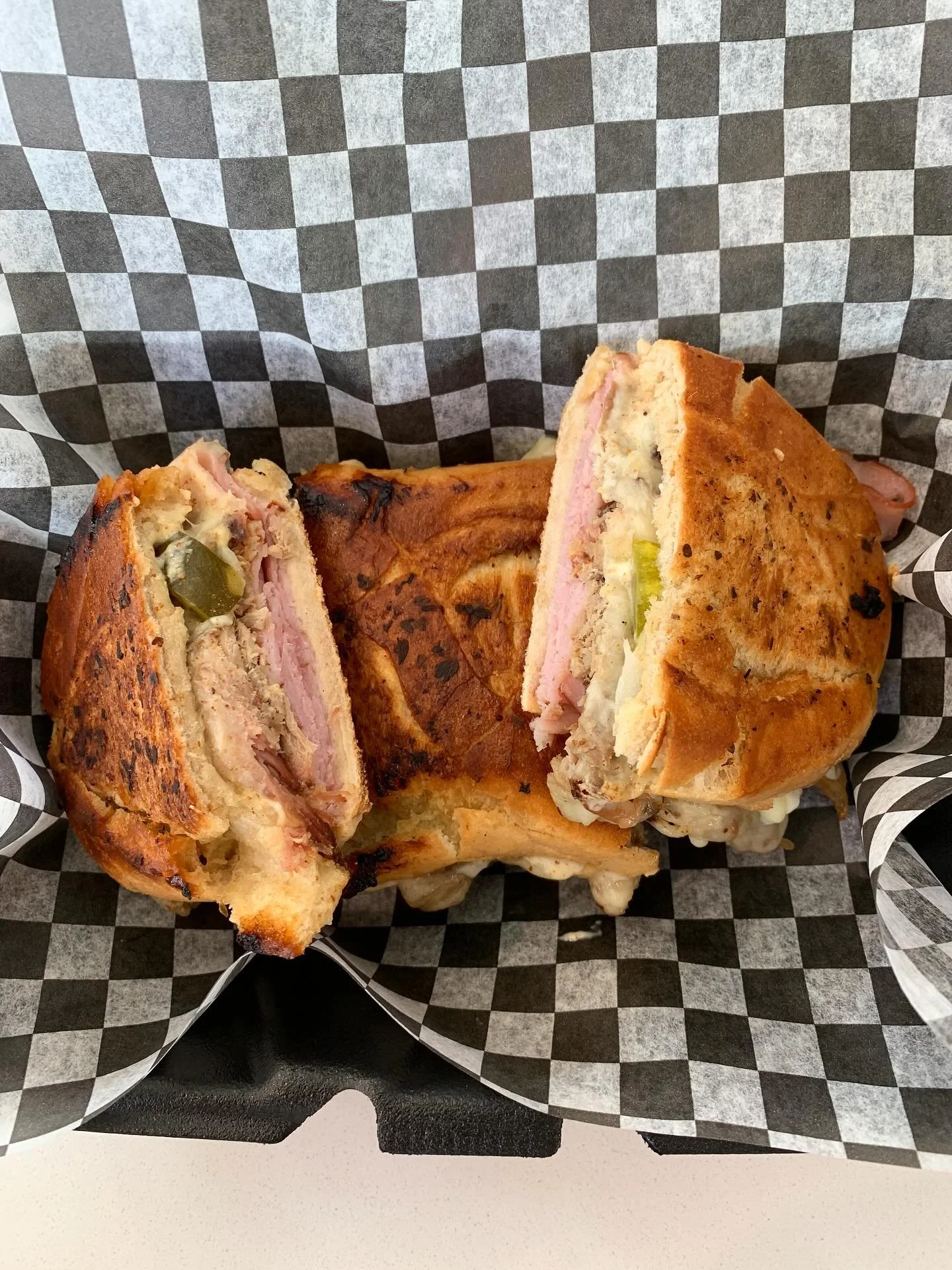 Stop by and try this crowd favorite: the Cuban Memories sandwich! 
🤎Tavern Ham, Pulled Pork, Swiss, Horseradish Sweet Pickles, Onion, Mayo, & Deli Mustard on a grilled pressed baguette.