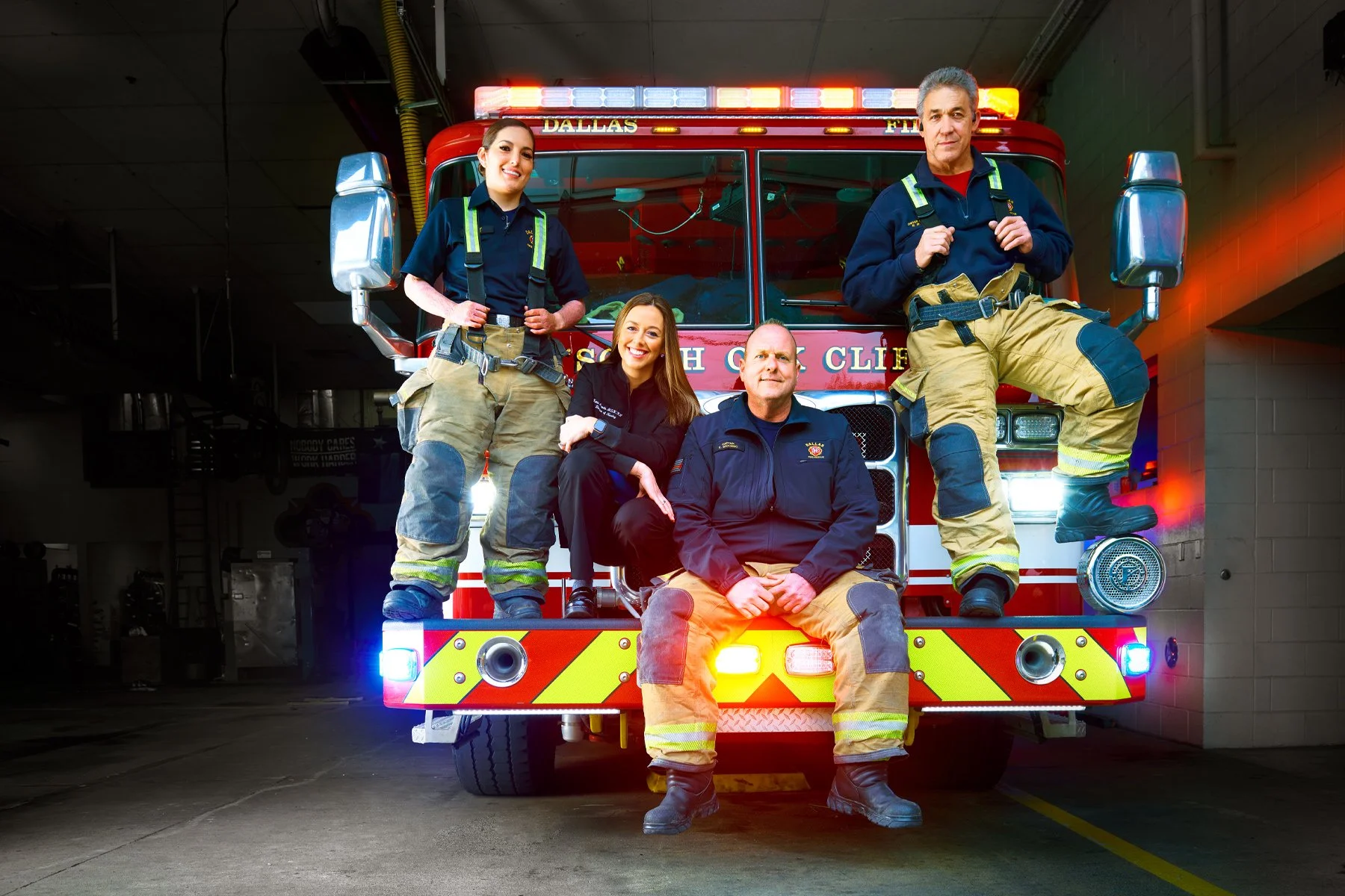 rescuers-back-at-Station-25-portrait-with-fire-truck.jpg