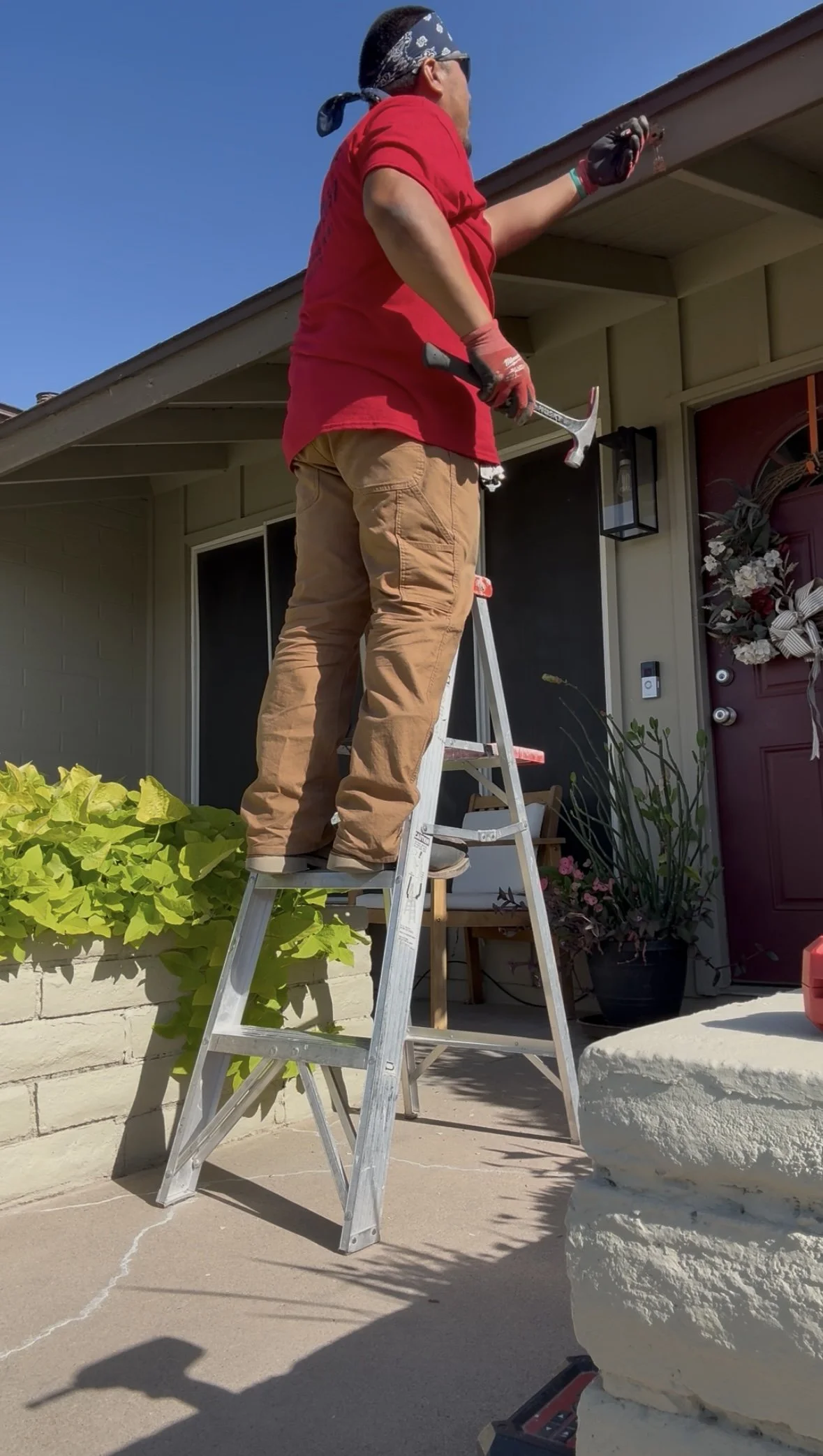 Hard working handyman at homeowners house