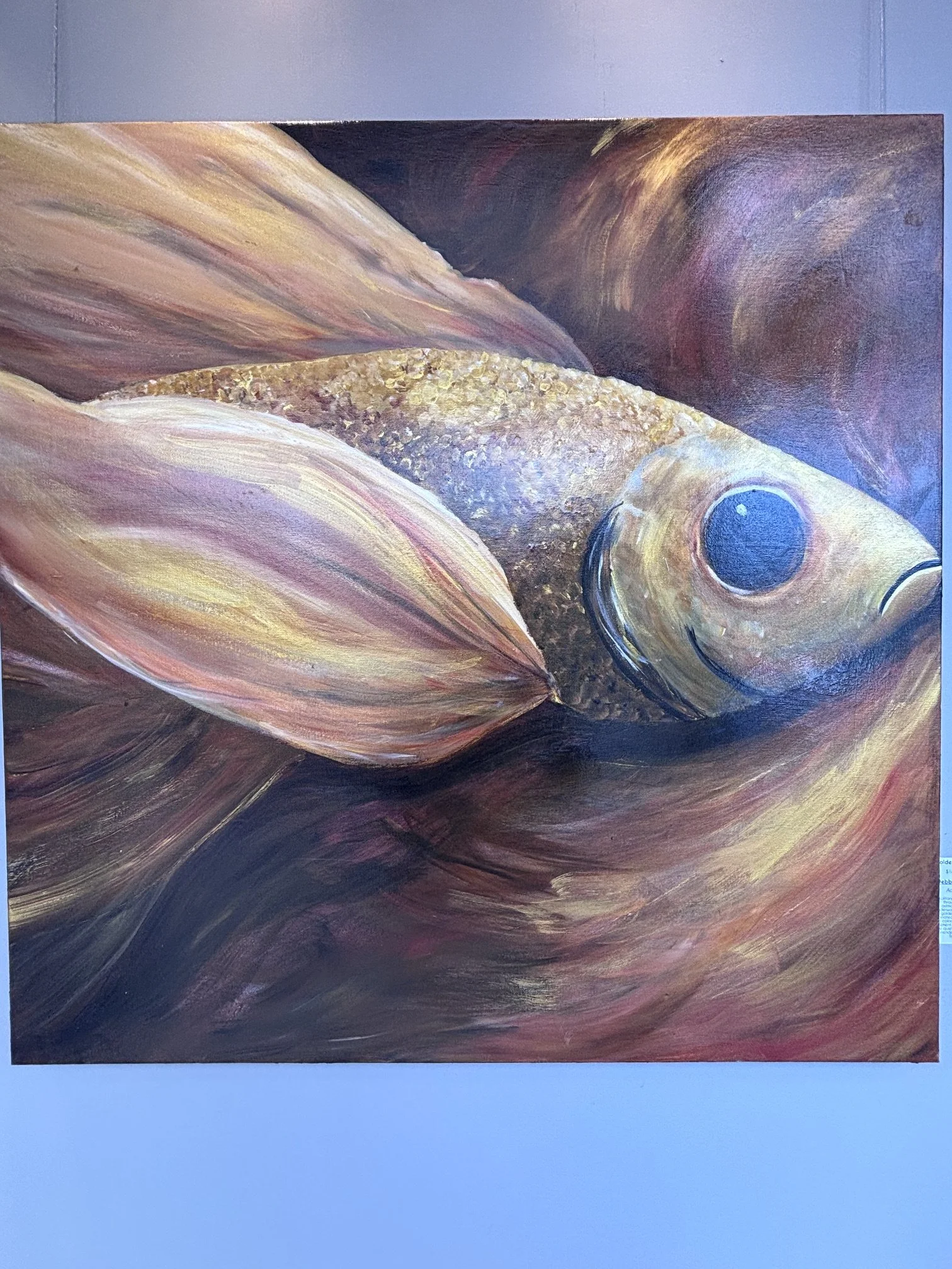 Debbie Nye; Golden Drift I; Acrylic; A solitary fish glides through an astmospheric underwater current, its golden scales illuminated by ribboms of color, exploring movement, stillness, and the quiet beauty of surrendering to the flow. ; $1,800