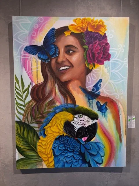 Thays Franca - Rainbows and Butterflies - Acrylic - $1800 - She carries the spirit of bright-winged guardians. Together, these spirits make her a creature of luminous contradiction. She does not simply exist in the world; she colors it.