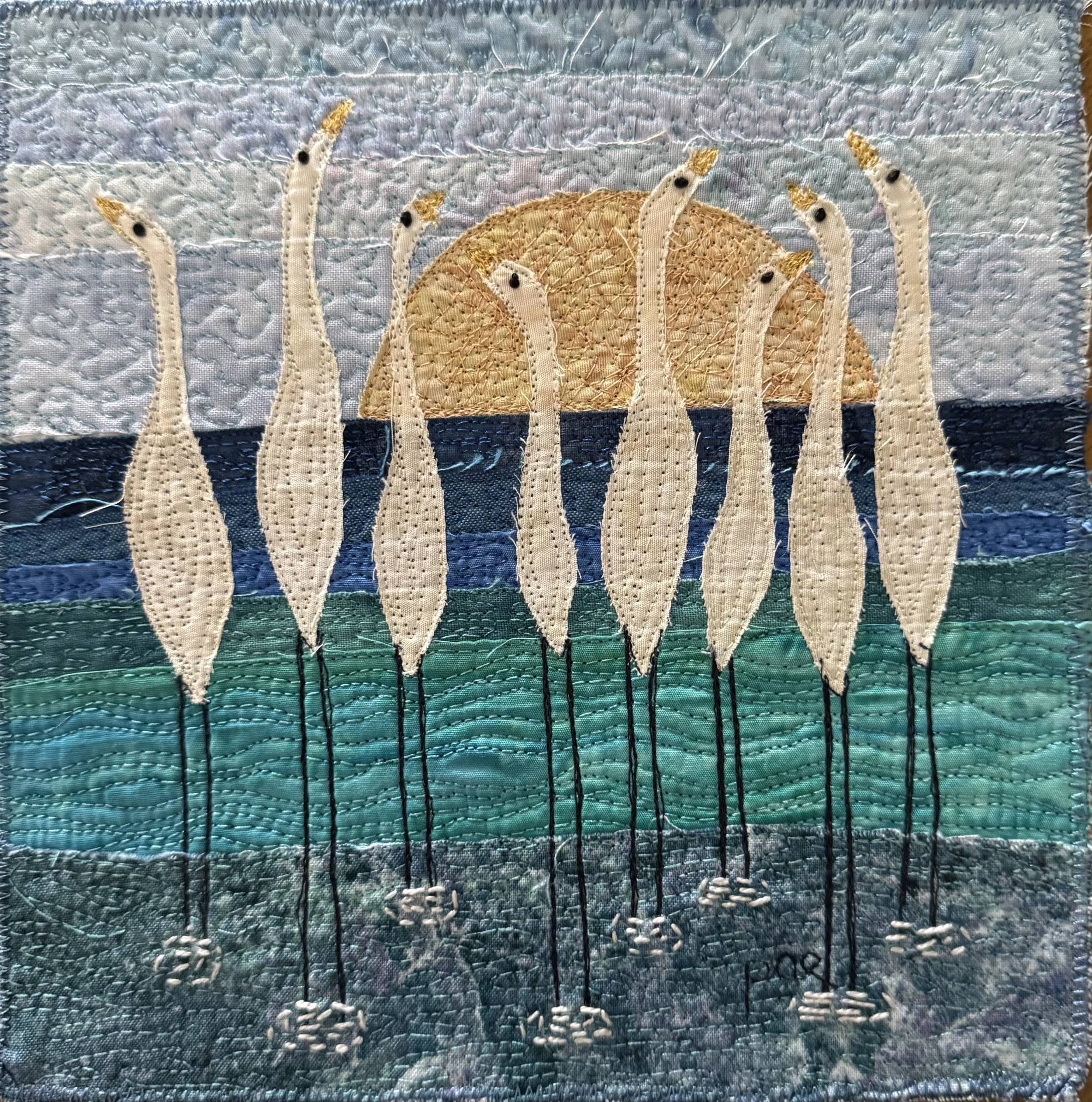 Peggy Epton - “Sunrise Gathering” - 10”x10” - Fiber: fabric and thread - These cranes represent peace. Due to their nature and alertness, cranes are seen as watchers. A group of cranes is called a sedge. - $395 - SOLD