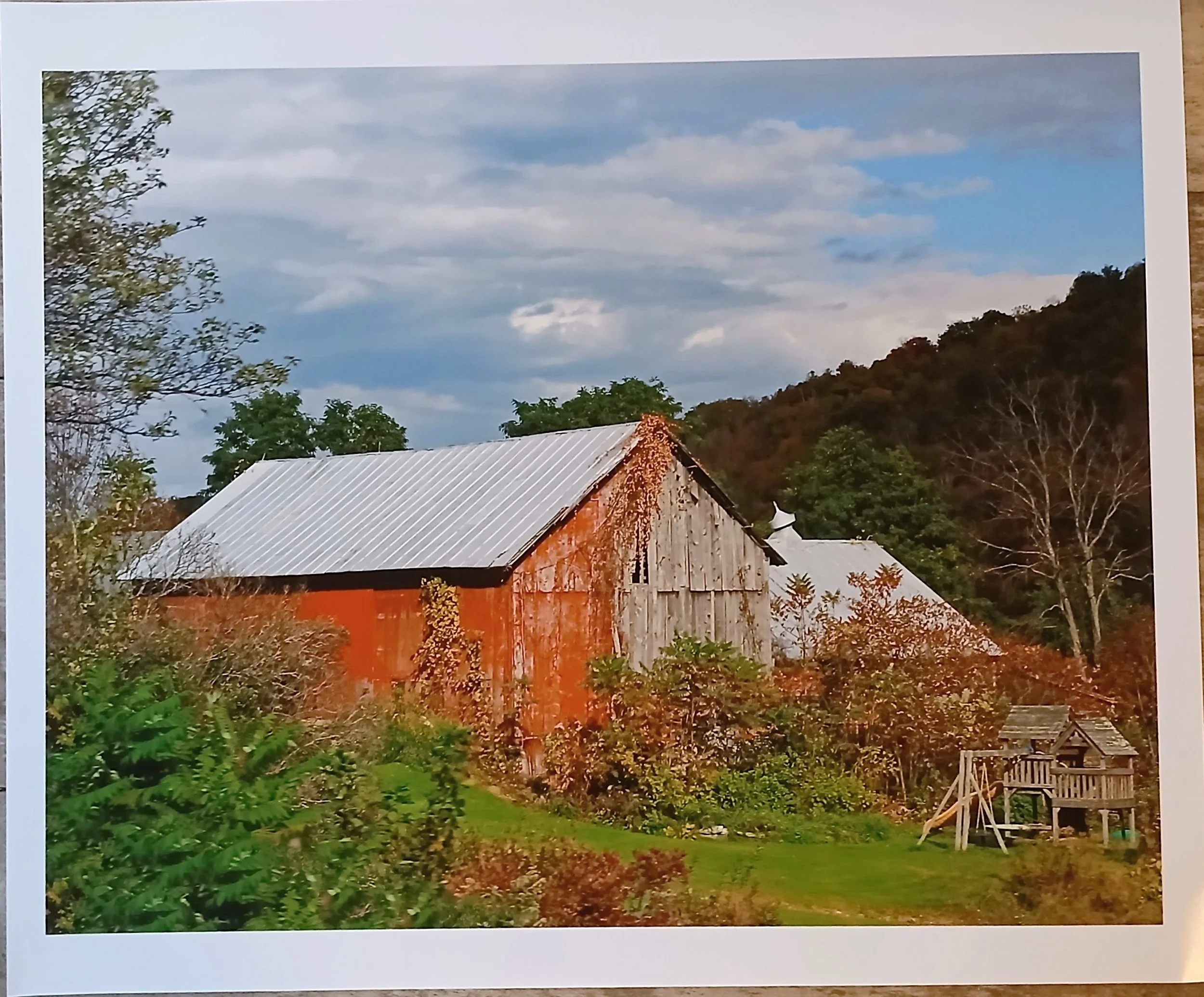 Scott Burdick; New England Nostalgia; 11 x 14; Photography; Found this old barn on a rural road in the Berkshire hills of Massachusetts.  Its old, weathered look was in contrast with the children's play set in the foreground.; $125