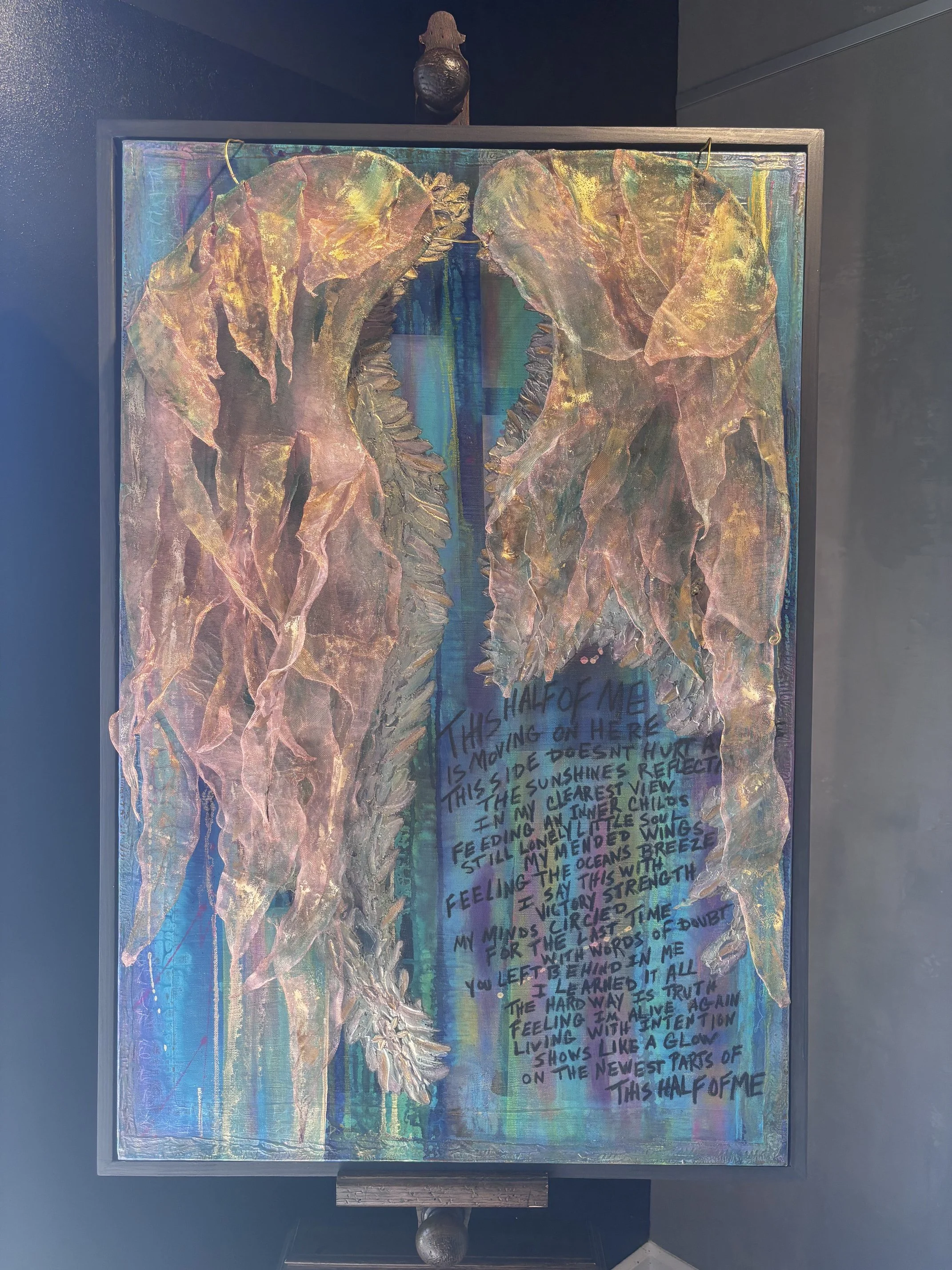 Barbette Jensen & Troy Wolfe; This Half of Me; 24x36; Mixed Media / Wire Sculpture Wings; With words of doubt, you left behind in me, learned it all the hard way. A collaboration in sculptural mesh and mixed media with an original poem by Troy.; $125