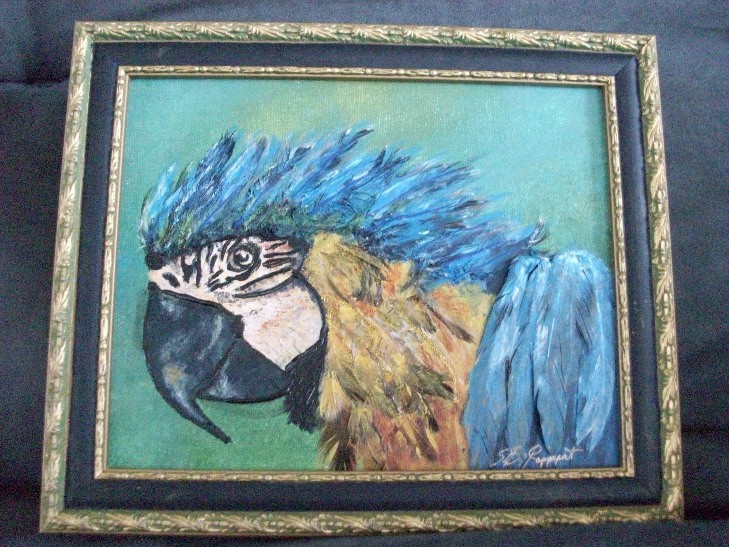 Sharon Rappaport; Quick Draw Macaw; Mixed Media; Macaws are smart, vibrant, noisy and mate for life.  This one sports his plumage proudly, in search of one for himself.; $115