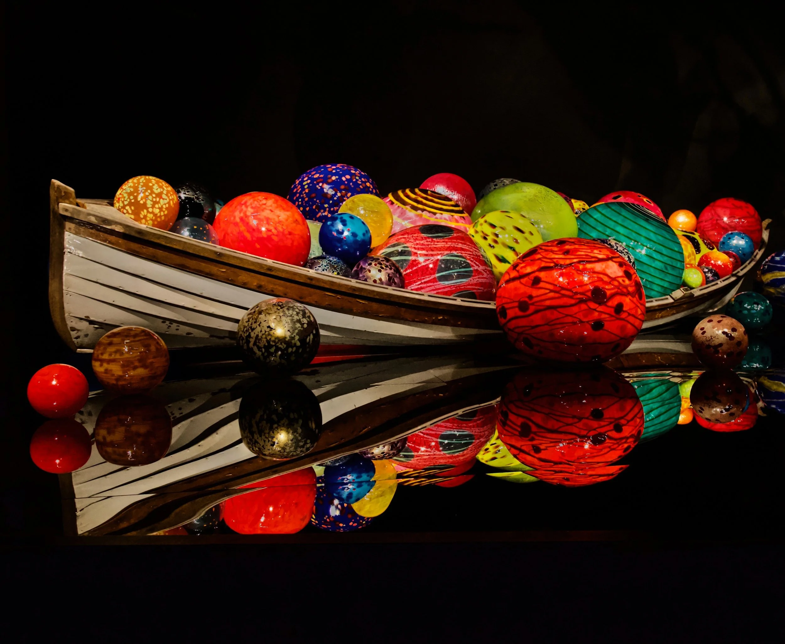 Nancy Haglund; Voyage of Color; Photography; 20 x 16; At the Chihuly Garden and Glass Museum in Seattle, this boat of vibrant glass spheres felt like a small journey of wonder. I wanted to capture the moment that made me pause.; $300