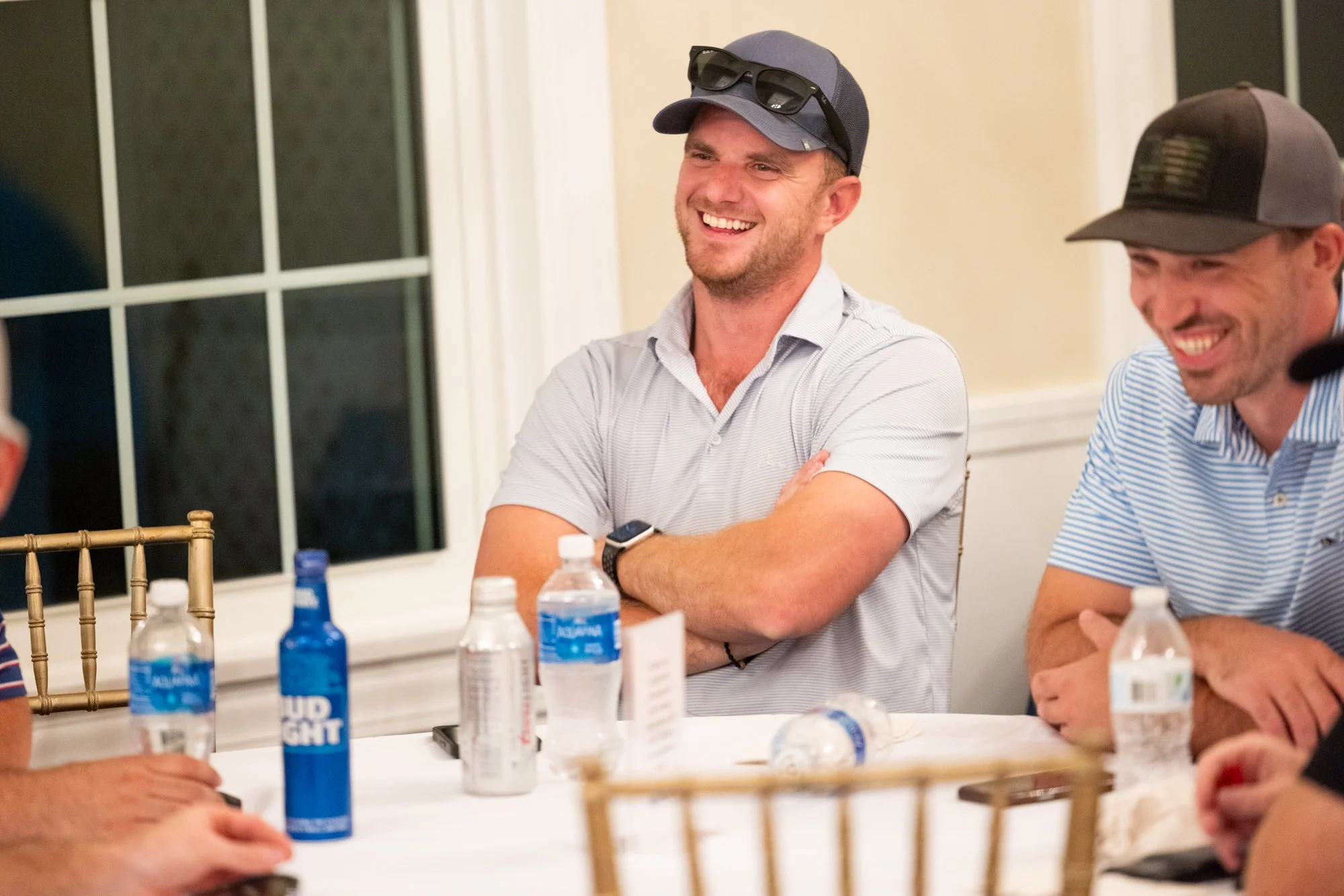 Man laughing during dinner
