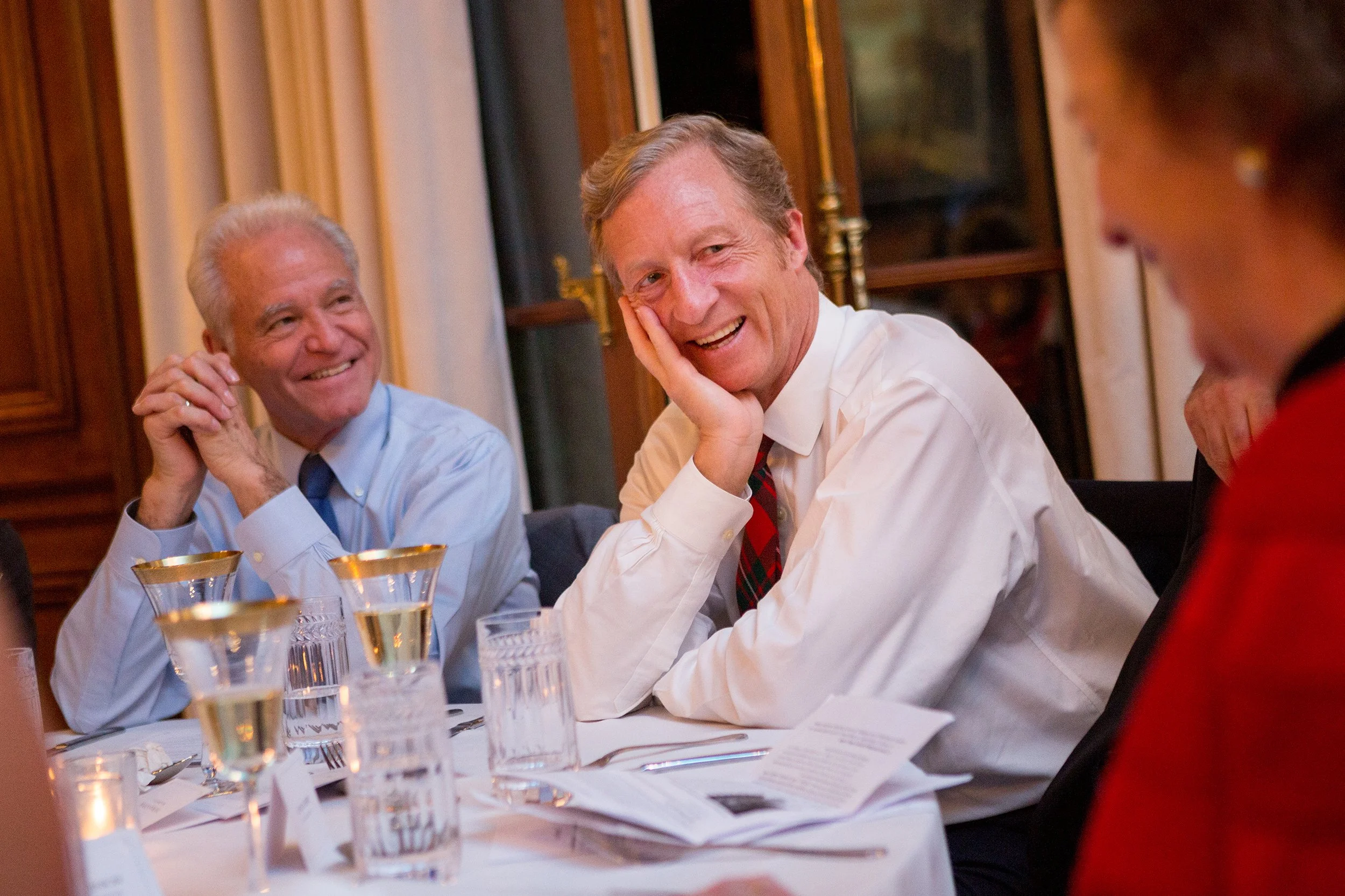 Man speaking at table during dinner party