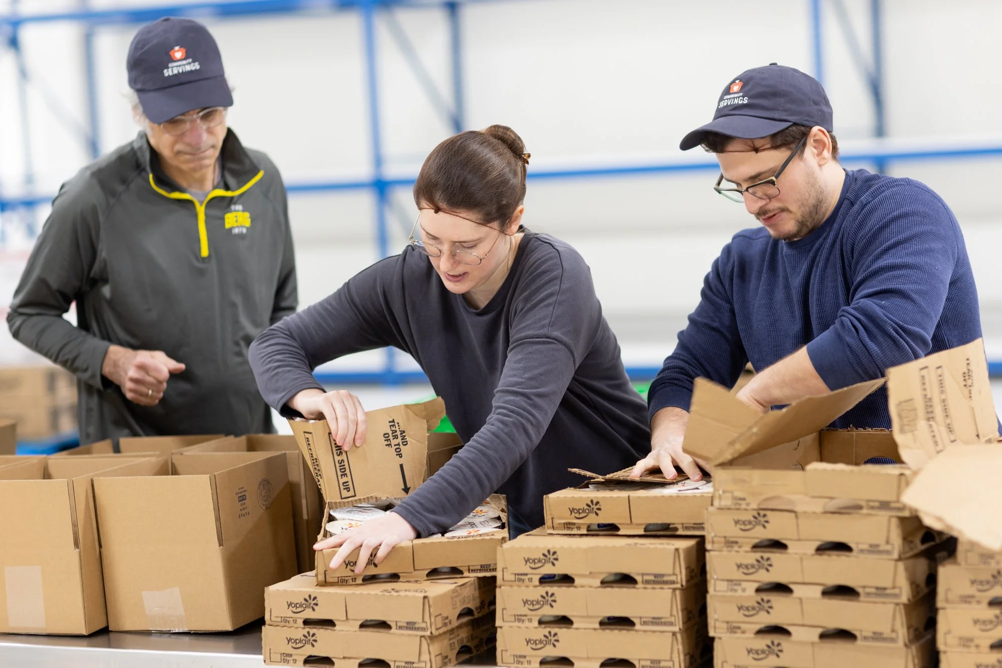 Group of people building boxes