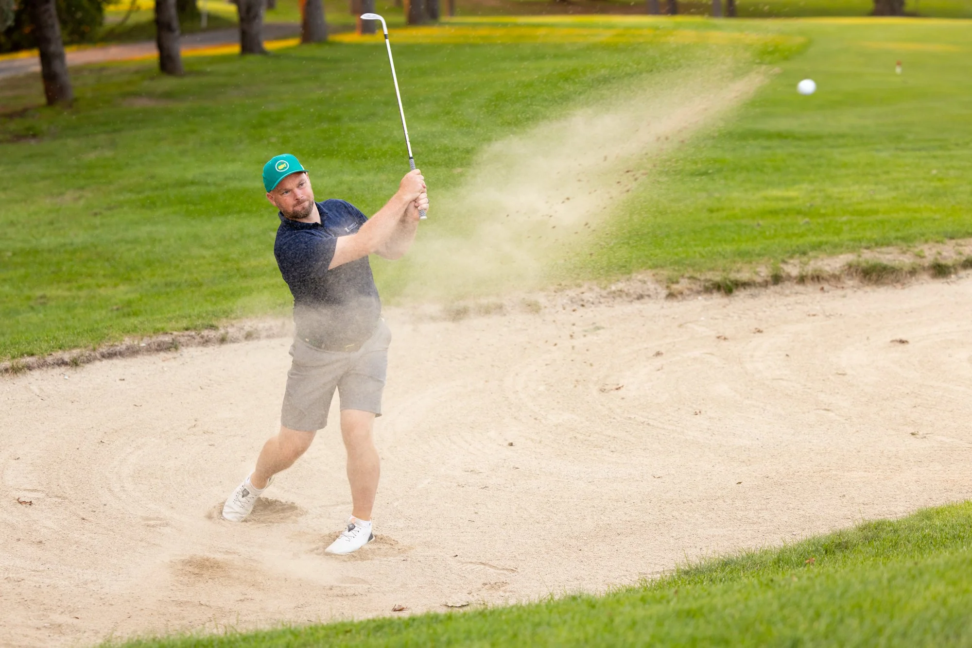 Hitting golf ball from sand trap