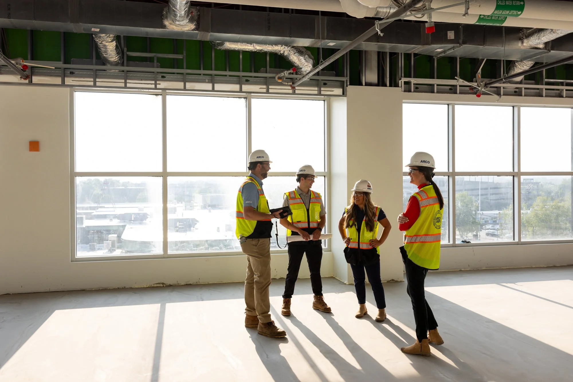 Group of construction workers in empty building