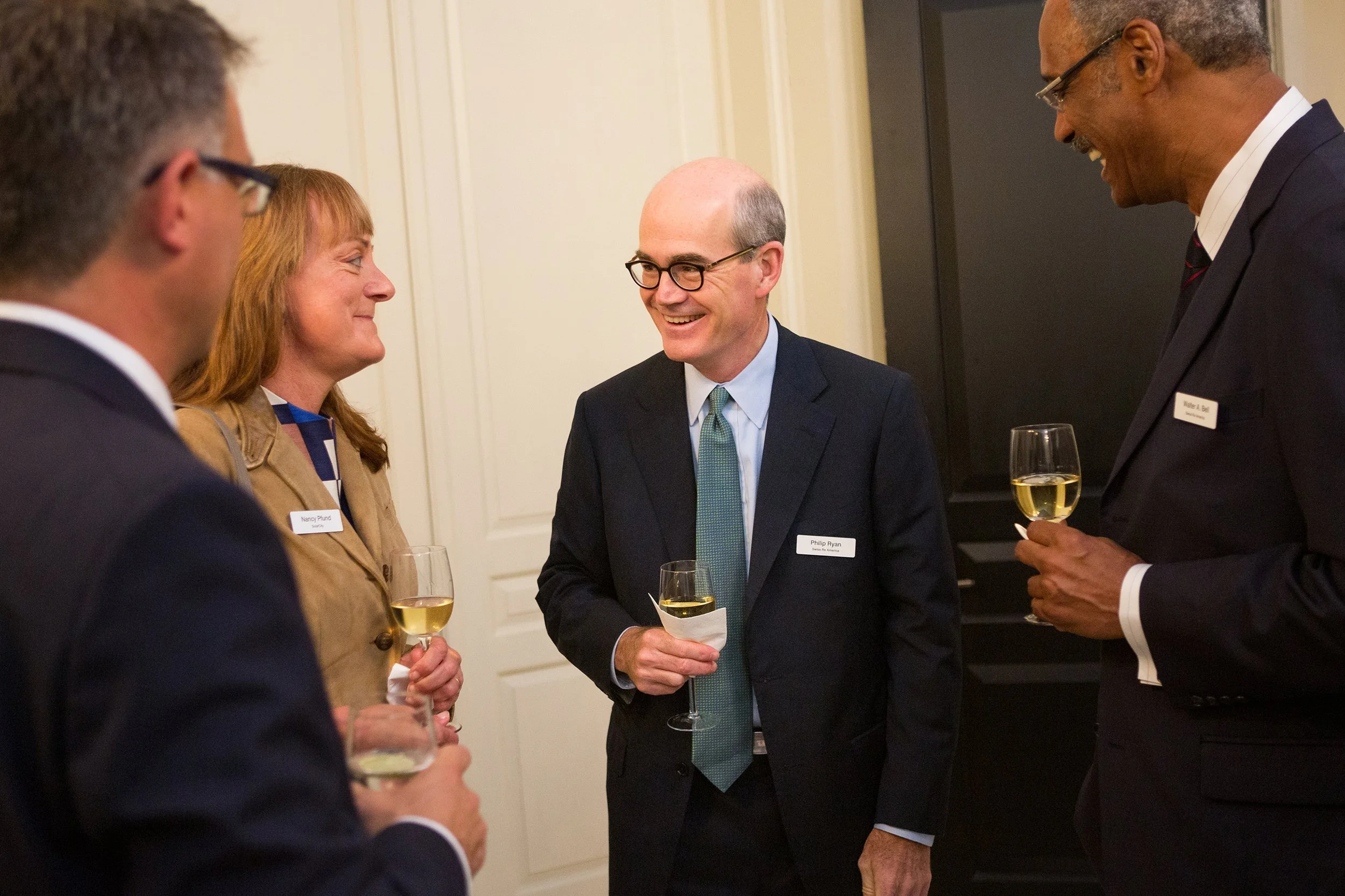 Group of 4 people speaking with each other