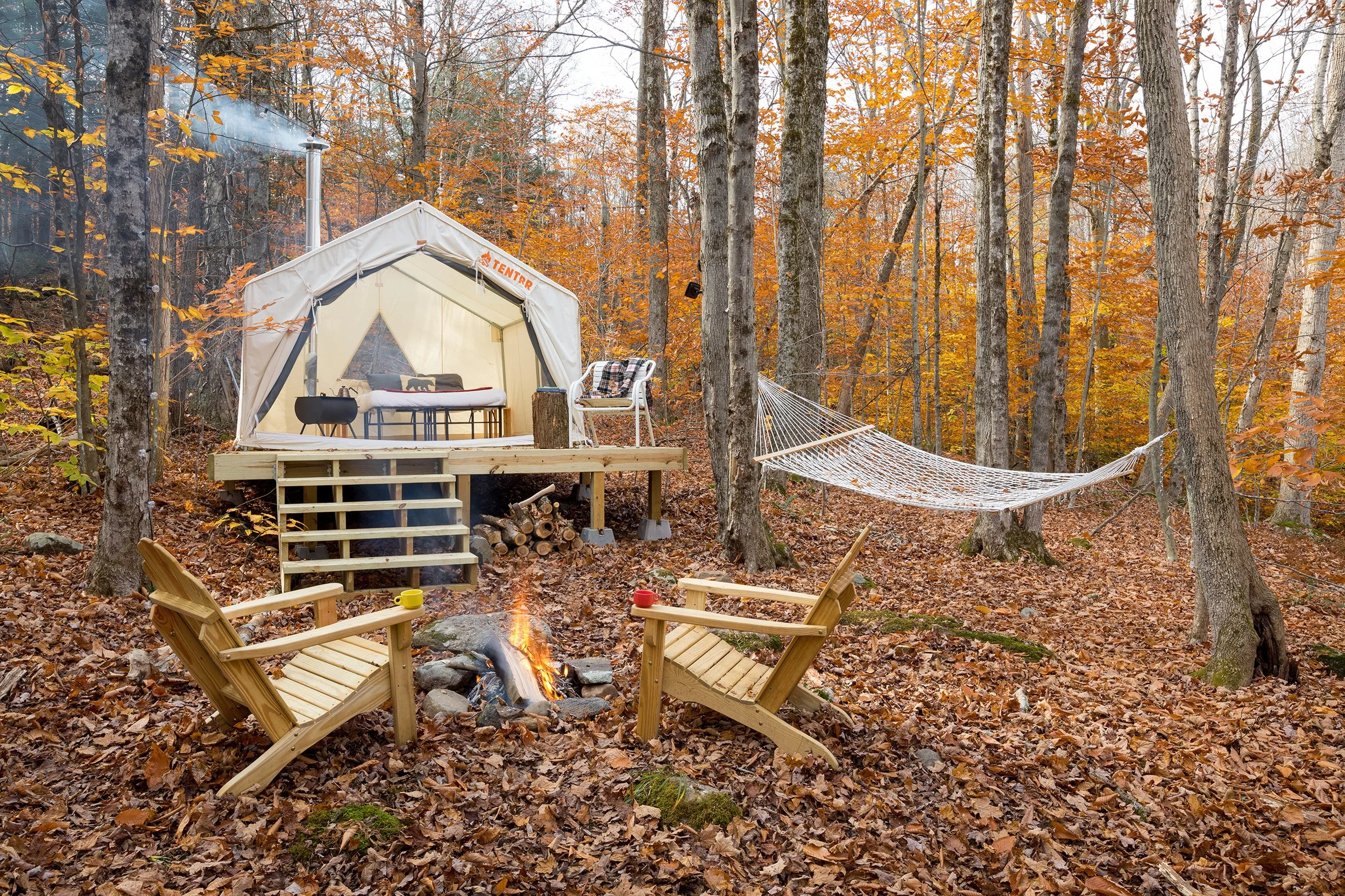 Tent site with chairs during autumn