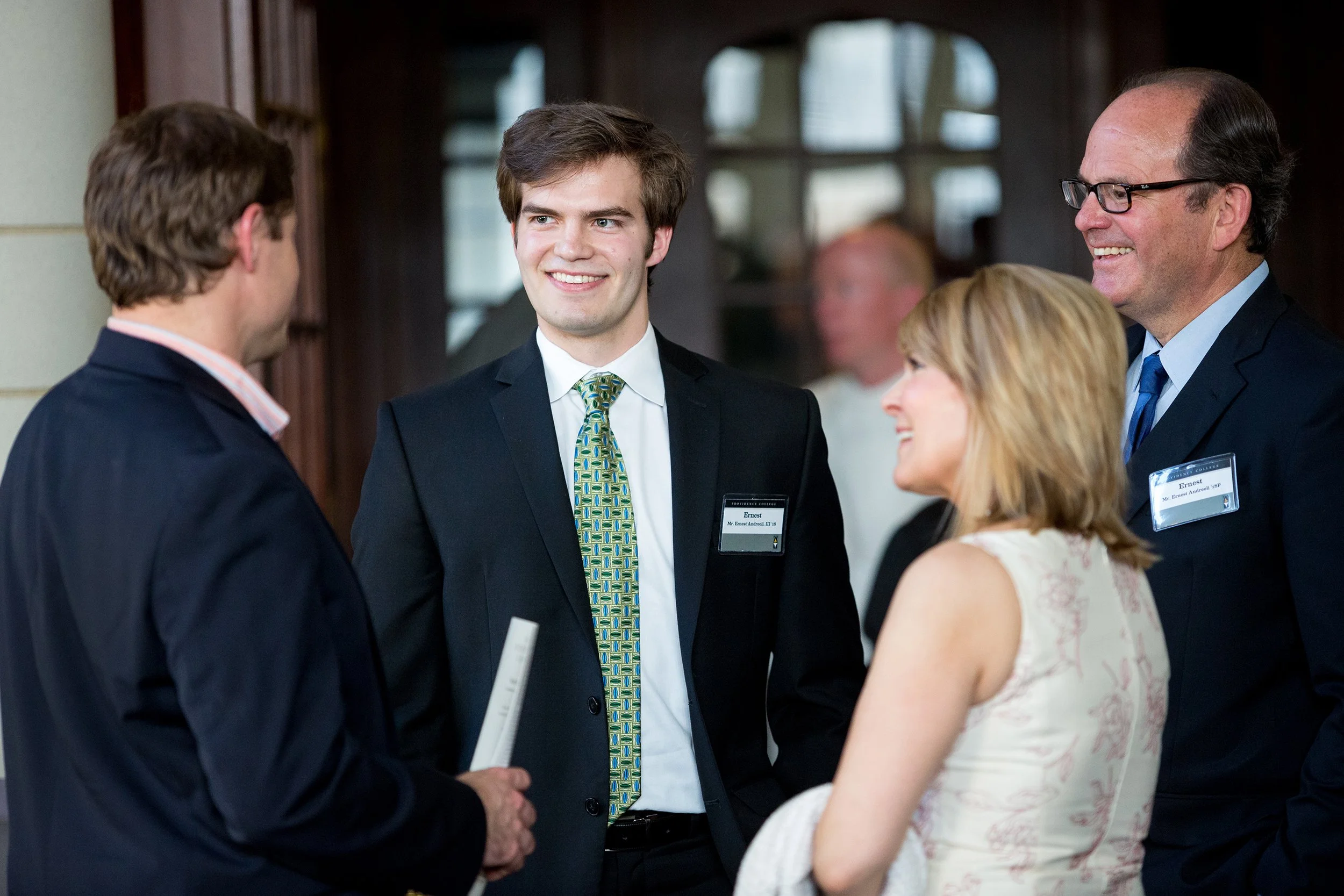 Group of people speaking together at event