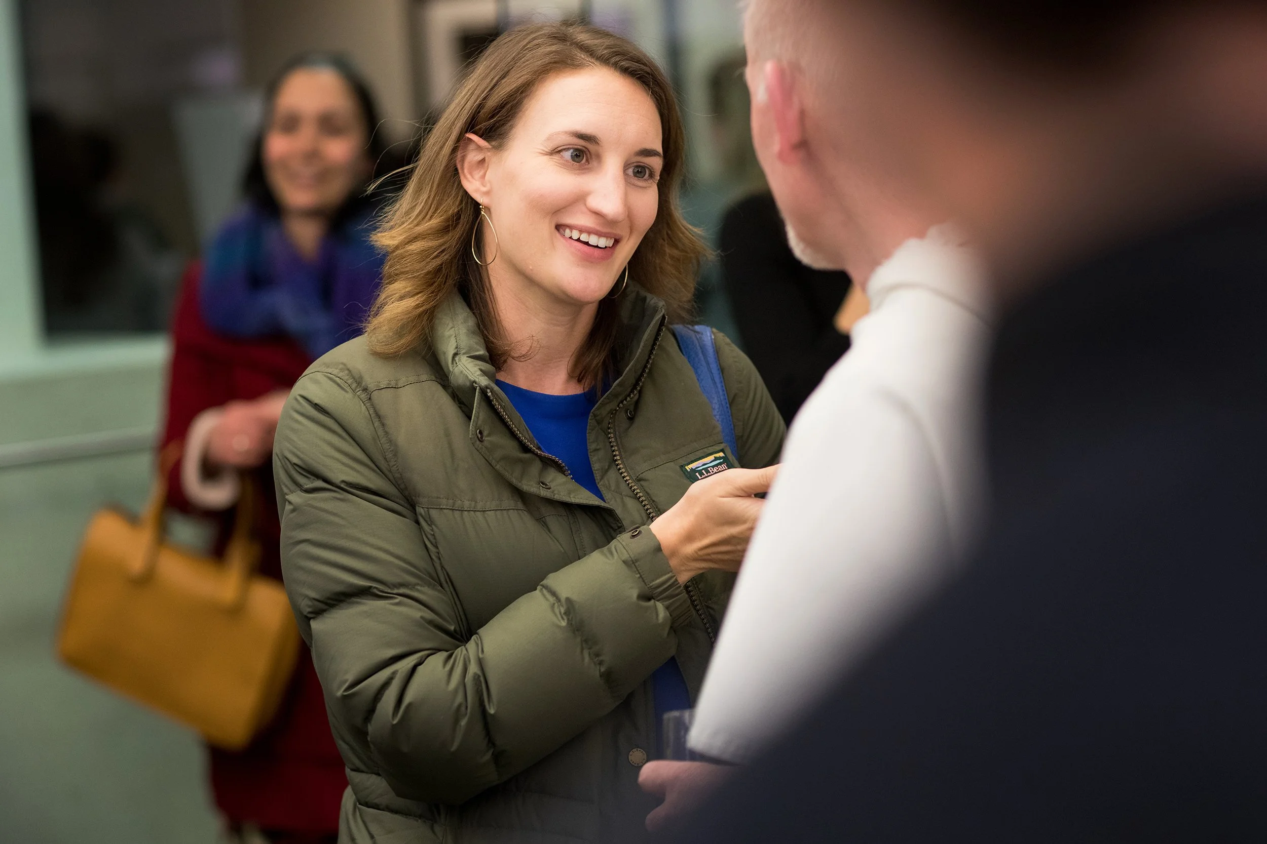 Woman speaking to another person at networking event