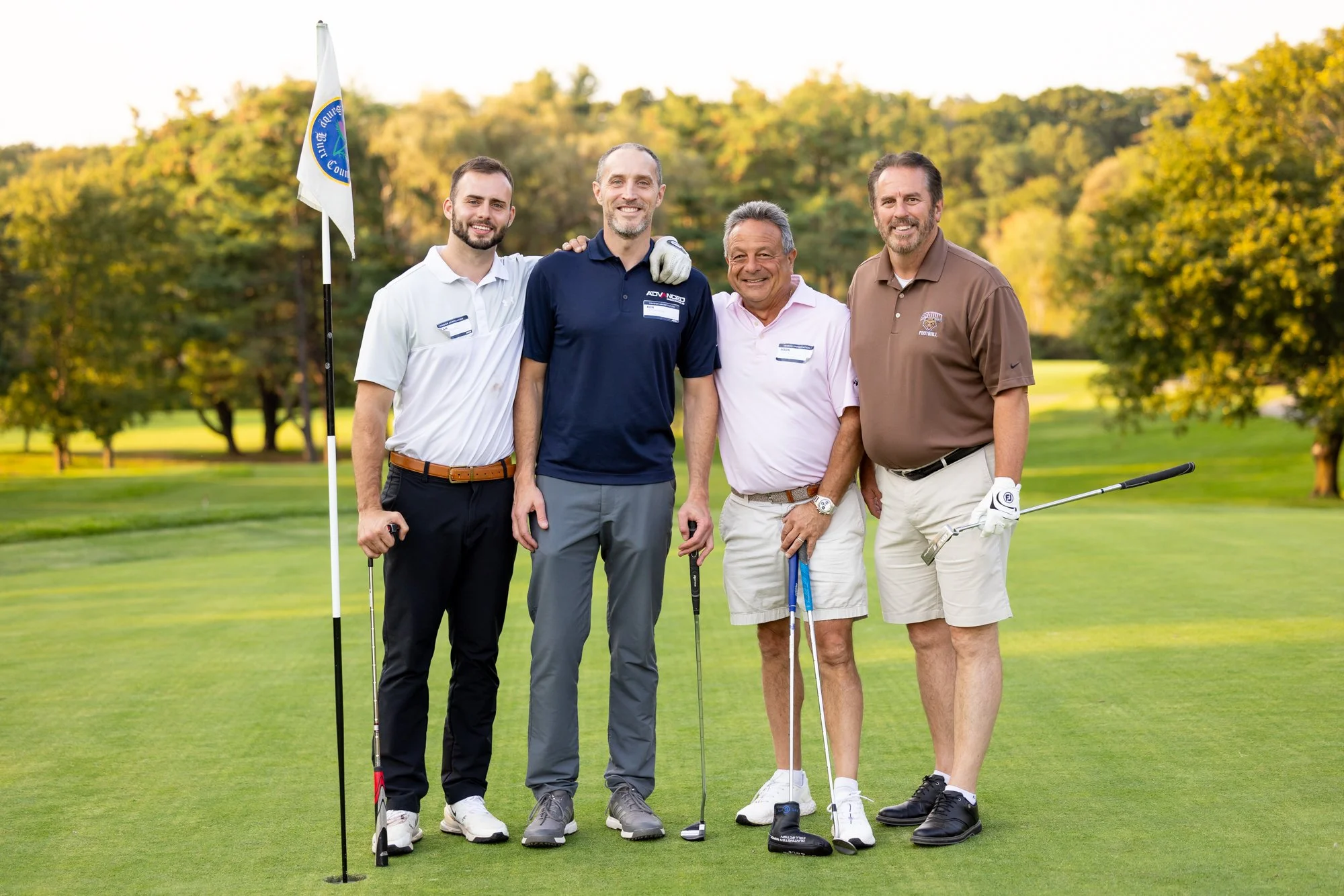 Group of golfers on putting green