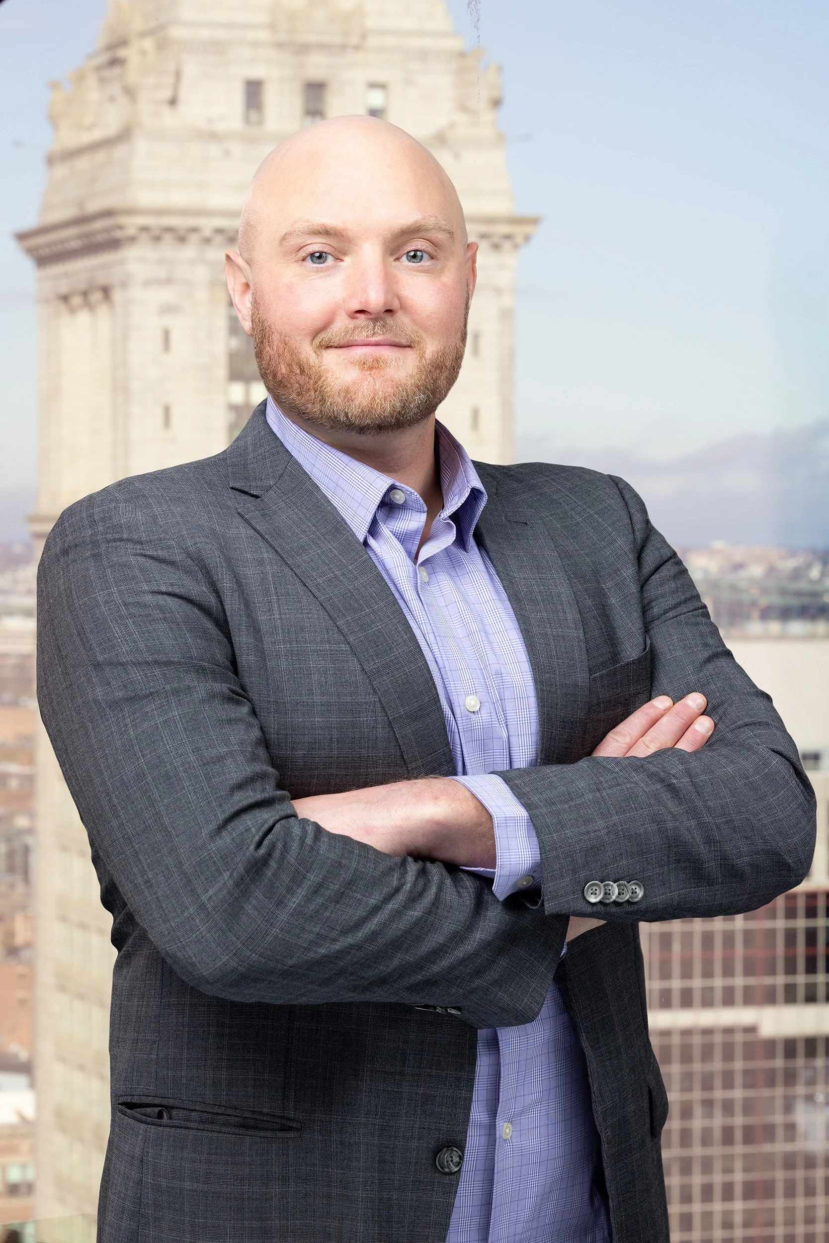 Portrait of man with city in background