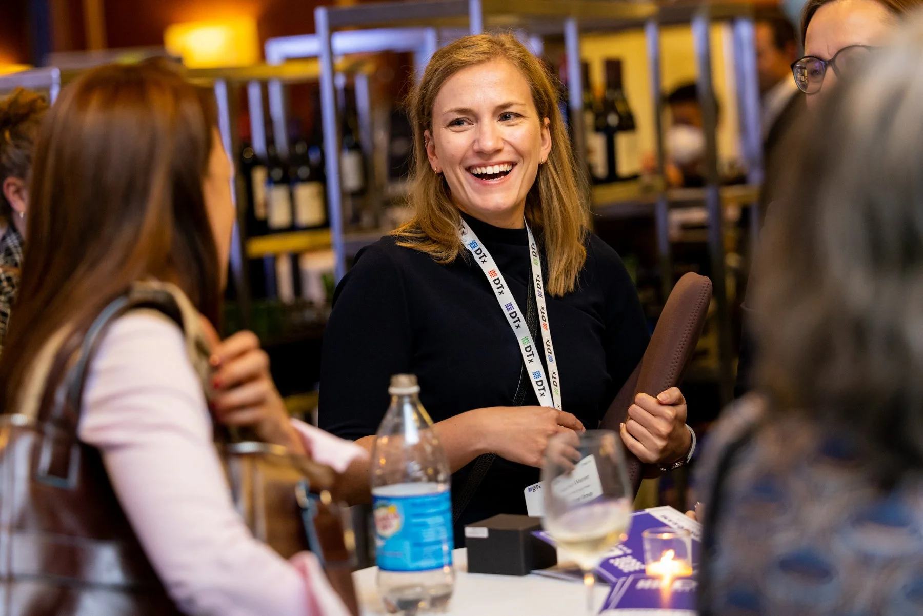 Woman laughing during cocktail hour