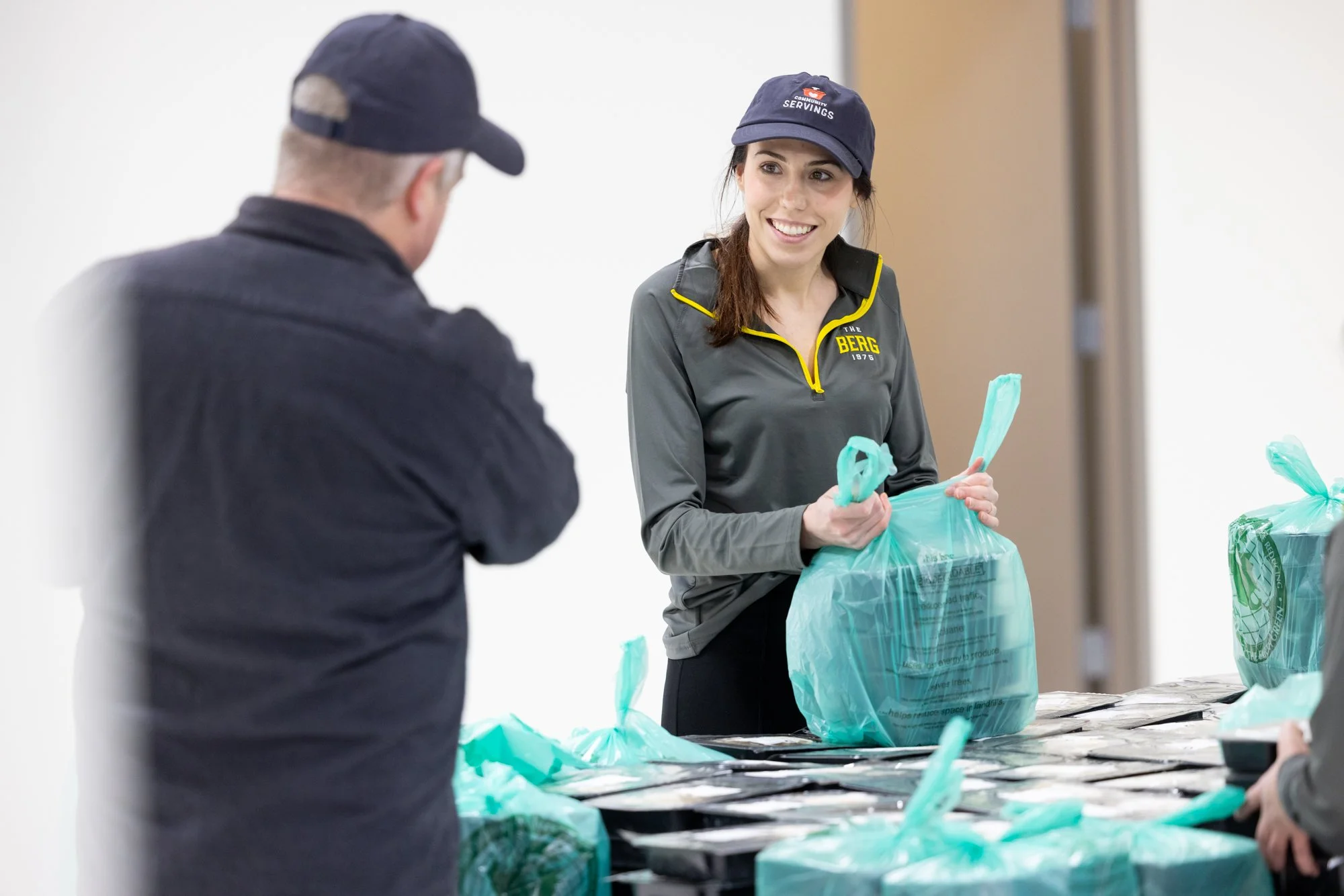 Woman packing bags at food bank