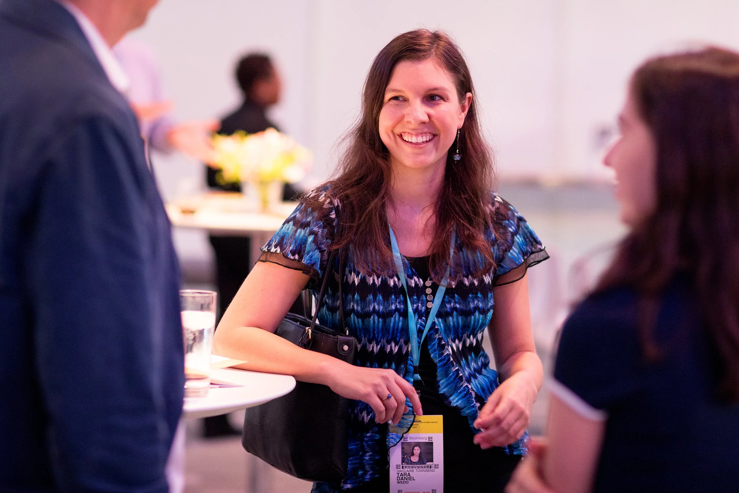 Three people networking at conference