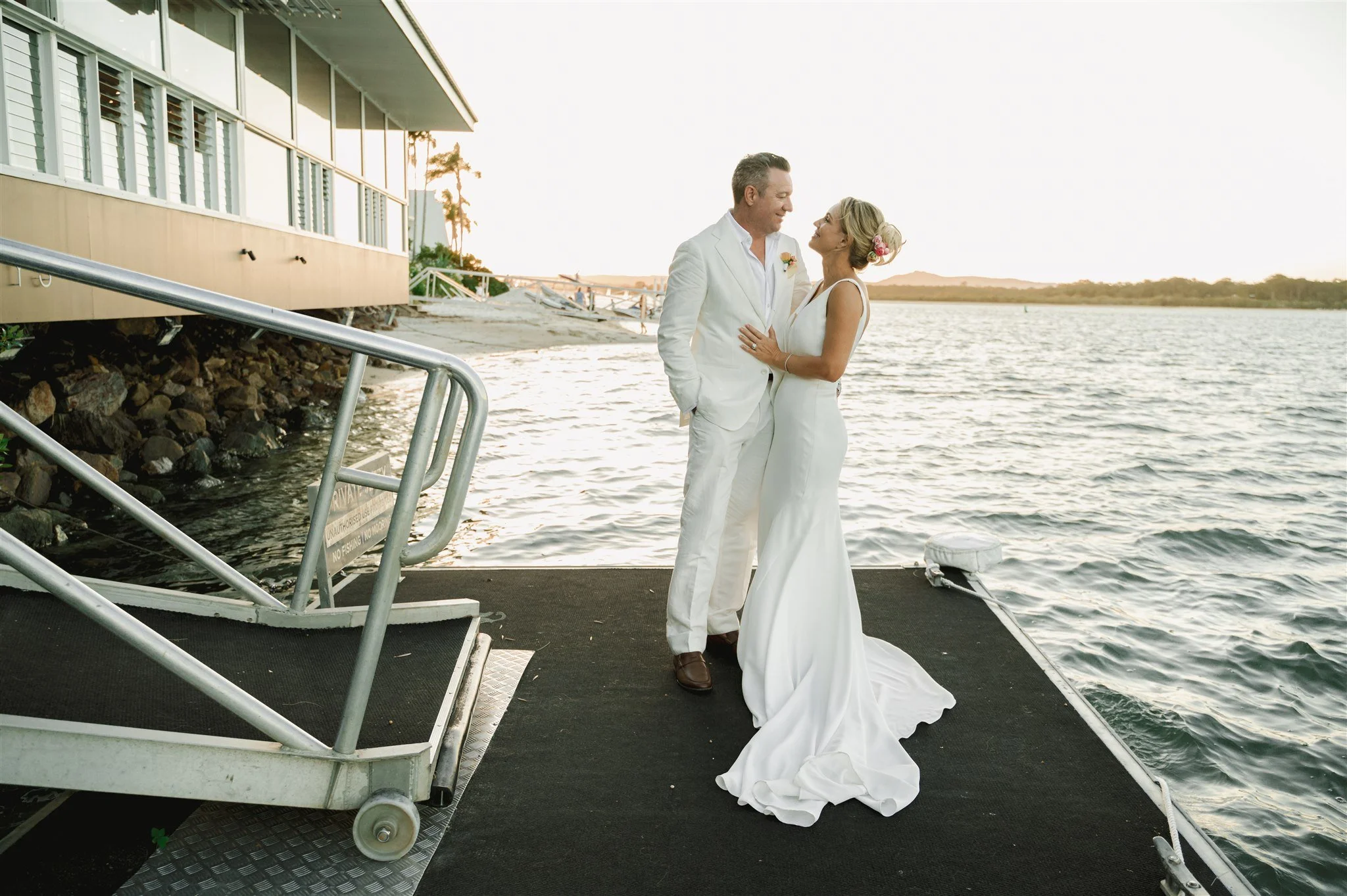 Discover Jessica & Peter's beautiful wedding at Ricky's River Bar & Restaurant in Noosa. Planned and styled by Lovebird Weddings with endless riverside photo opportunities and timeless styling.