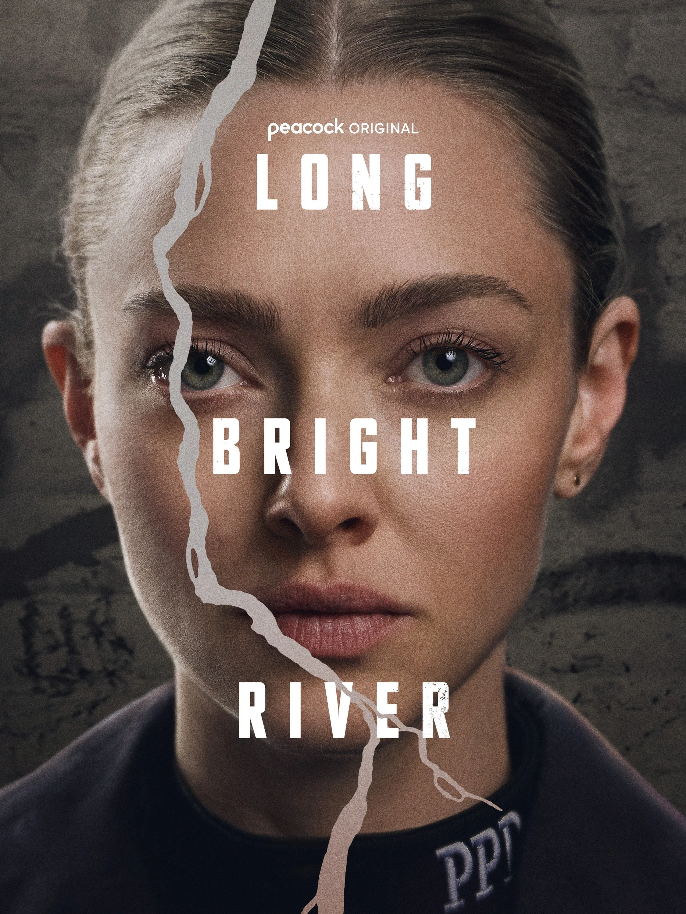 A close-up portrait of a woman's face split by a graphic of a river with the words "Long," "Bright," and "River" overlaid, along with the text "Peacock Original."