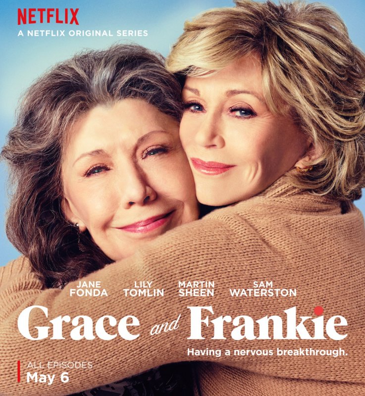 Two women hugging, smiling, with text indicating it is a Netflix original series called 'Grace and Frankie', starring Jane Fonda, Lily Tomlin, Martin Sheen, and Sam Waterston, premiering May 6.