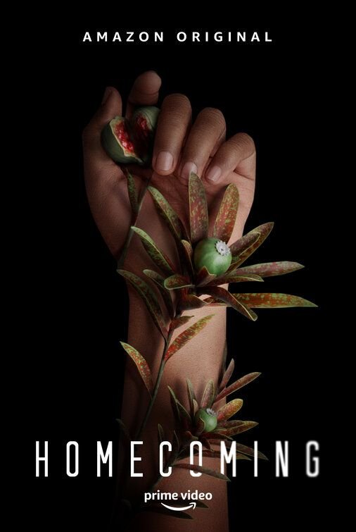 A hand holding a branch with green berries and leaves, set against a dark background. The text reads "Amazon Original Homecoming" and the Amazon Prime Video logo is at the bottom.
