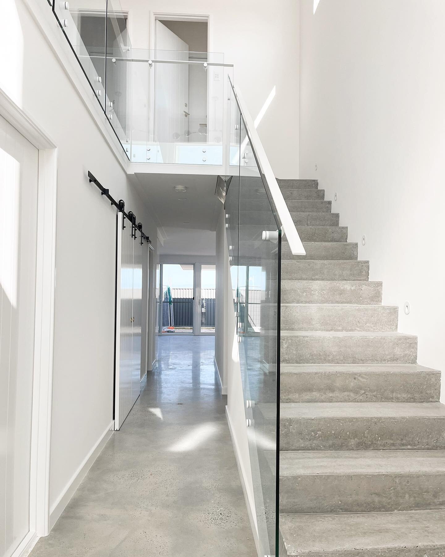 Loving the Matt White finishes 
on this beautiful, raw concrete staircase!
I have seen a few of our projects finished in Matt black&hellip;but it was SO cool seeing the white!! 

What do you think?