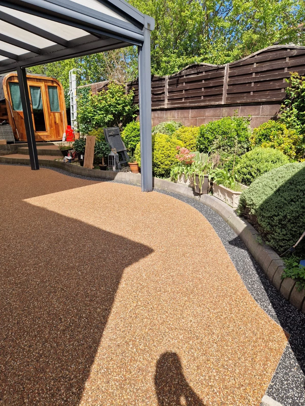 Resin patio installed using Polaris border with rose garden rcoloured resin  by Perfecta Connect