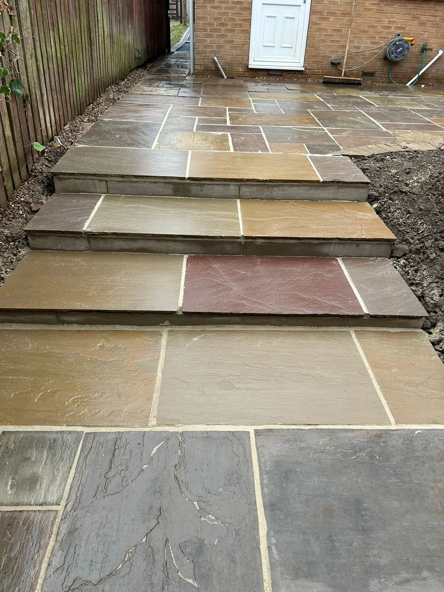 Finished Indian stone patio and pathway project by Perfecta Connect