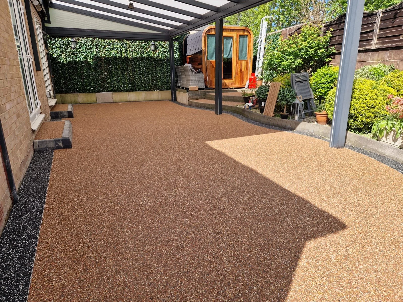 Polaris patio resin bound and rose garden resin patio border installation by Perfecta Connect